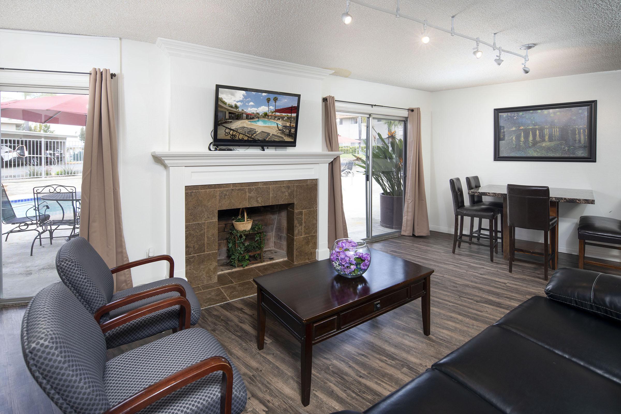 a living room filled with furniture and a fire place