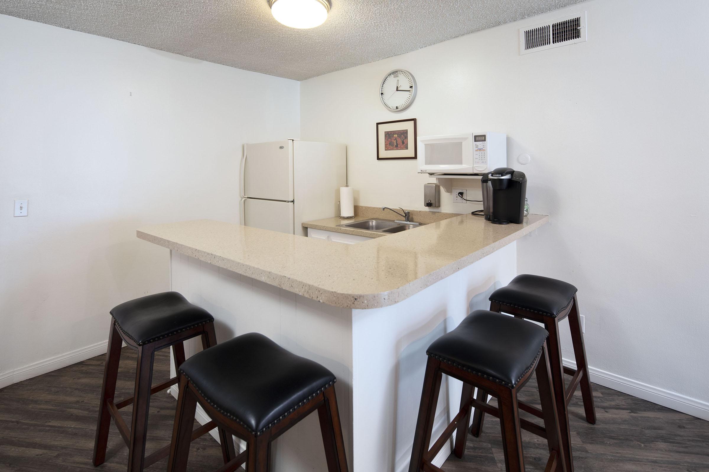 a desk with a chair in a room