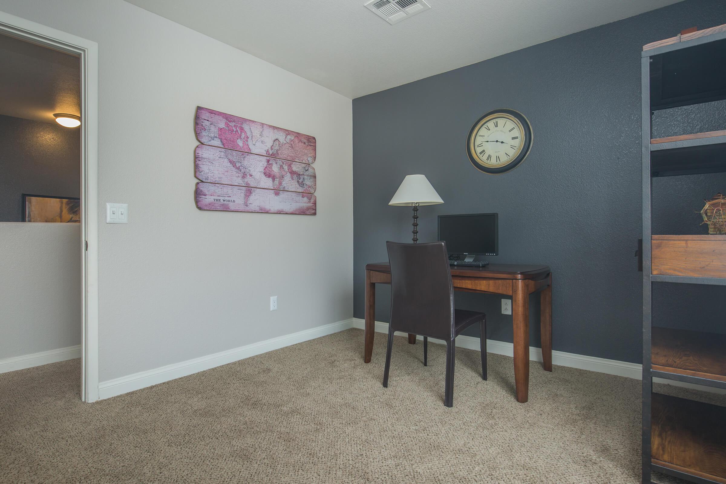 a living room with a clock on the floor