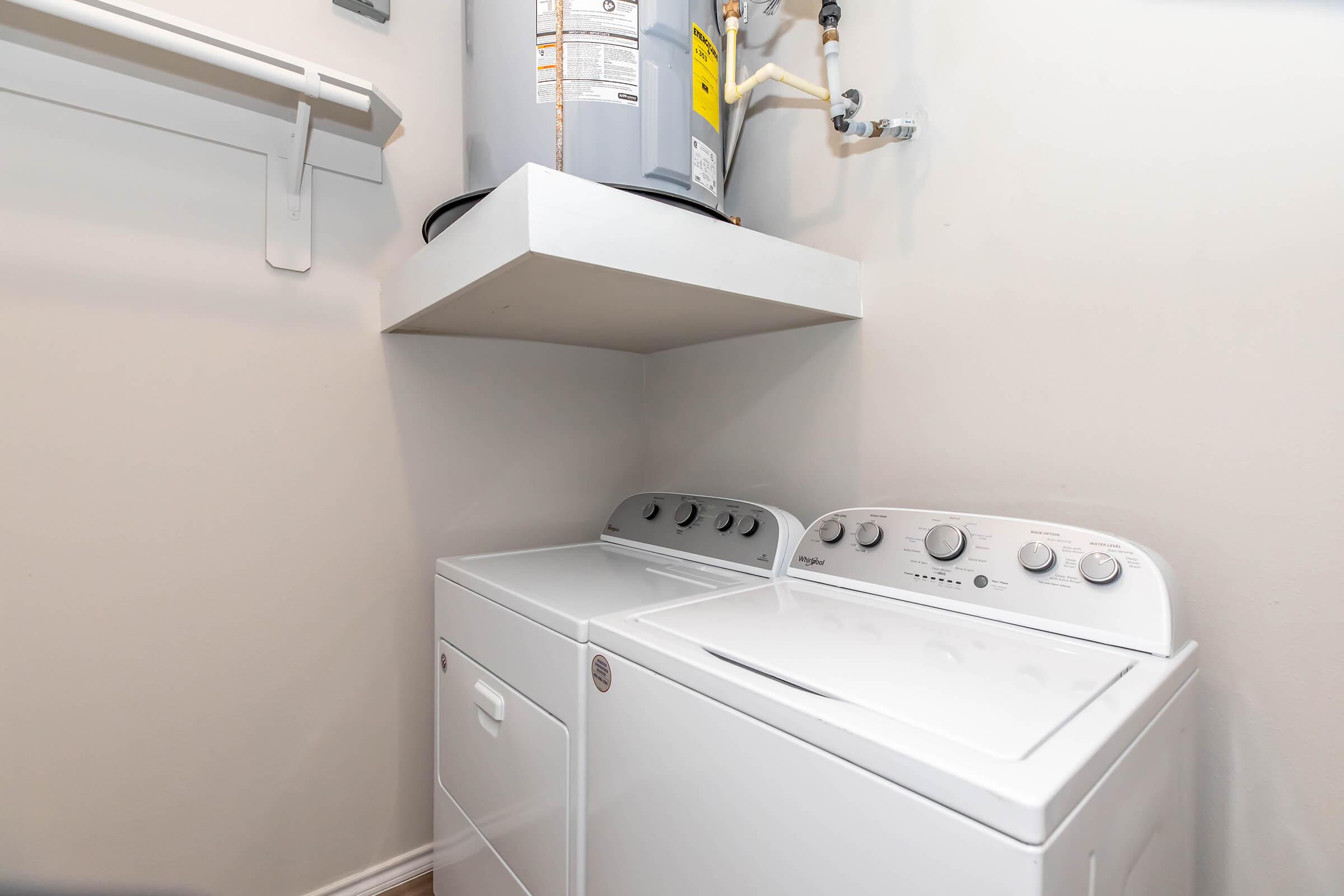 a stove top oven sitting next to a sink