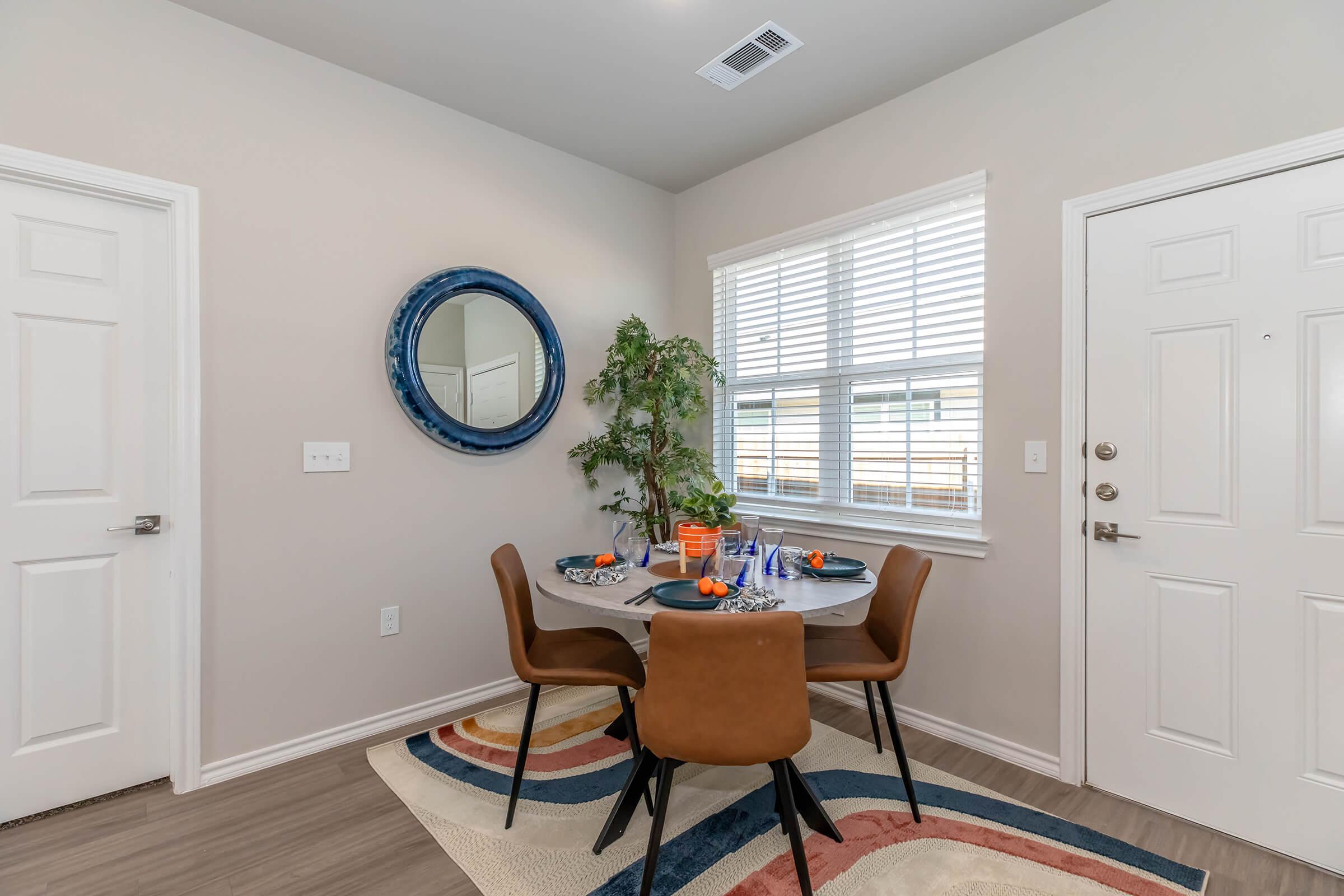 a living room filled with furniture and a large window