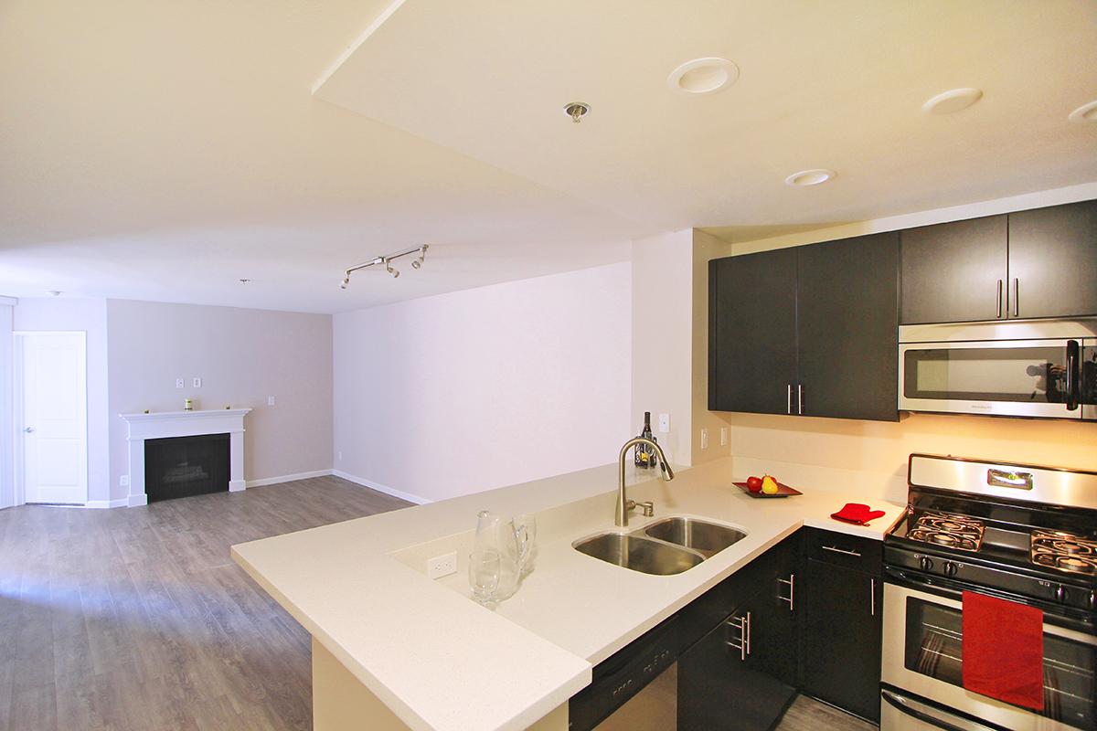 a modern kitchen with stainless steel appliances