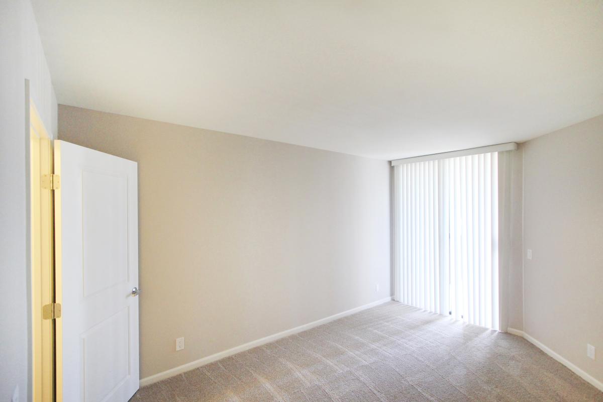 a bedroom with a bed in a room