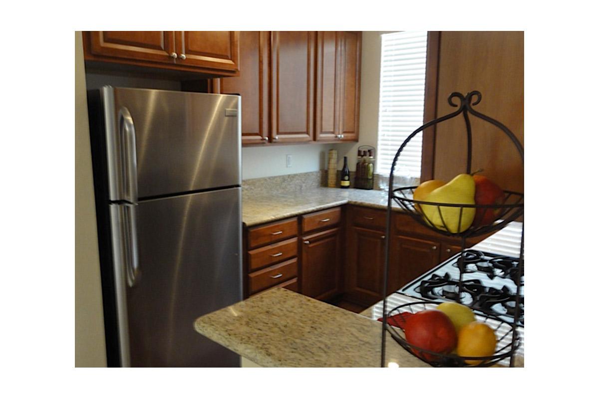 a stainless steel refrigerator in a kitchen