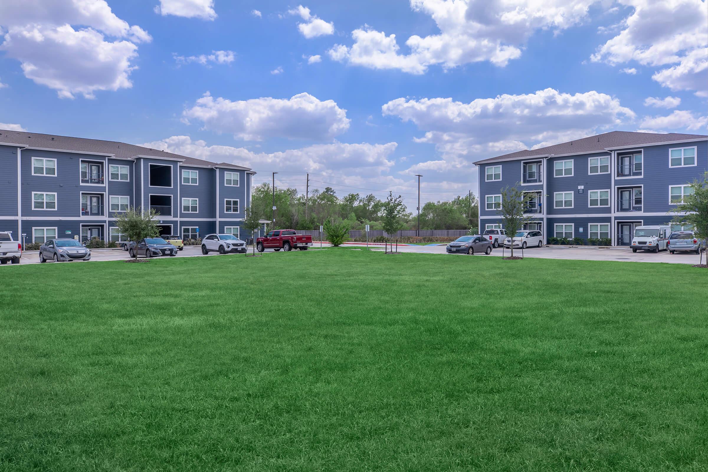 a building with a grassy field