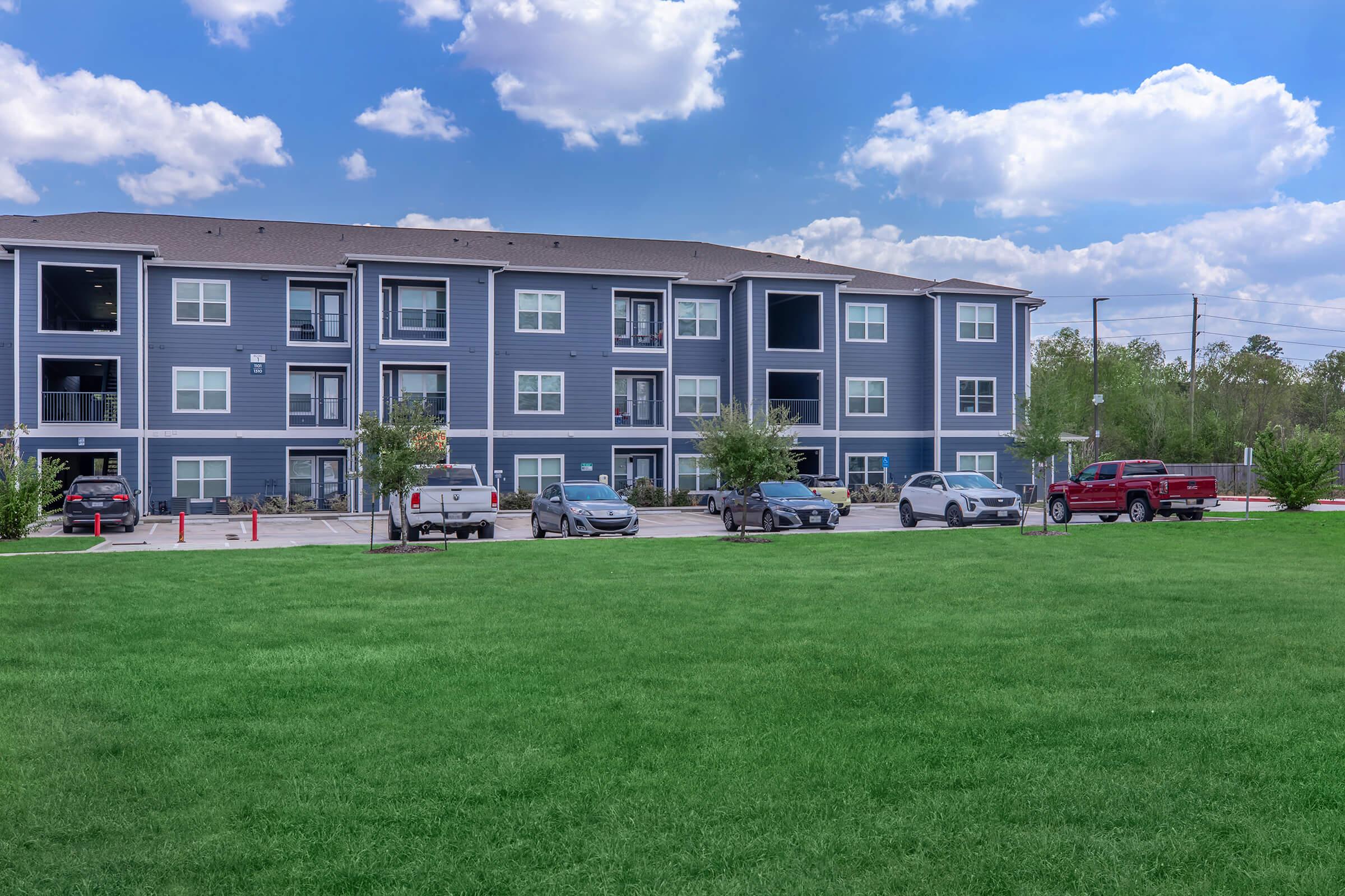 a building with a grassy field