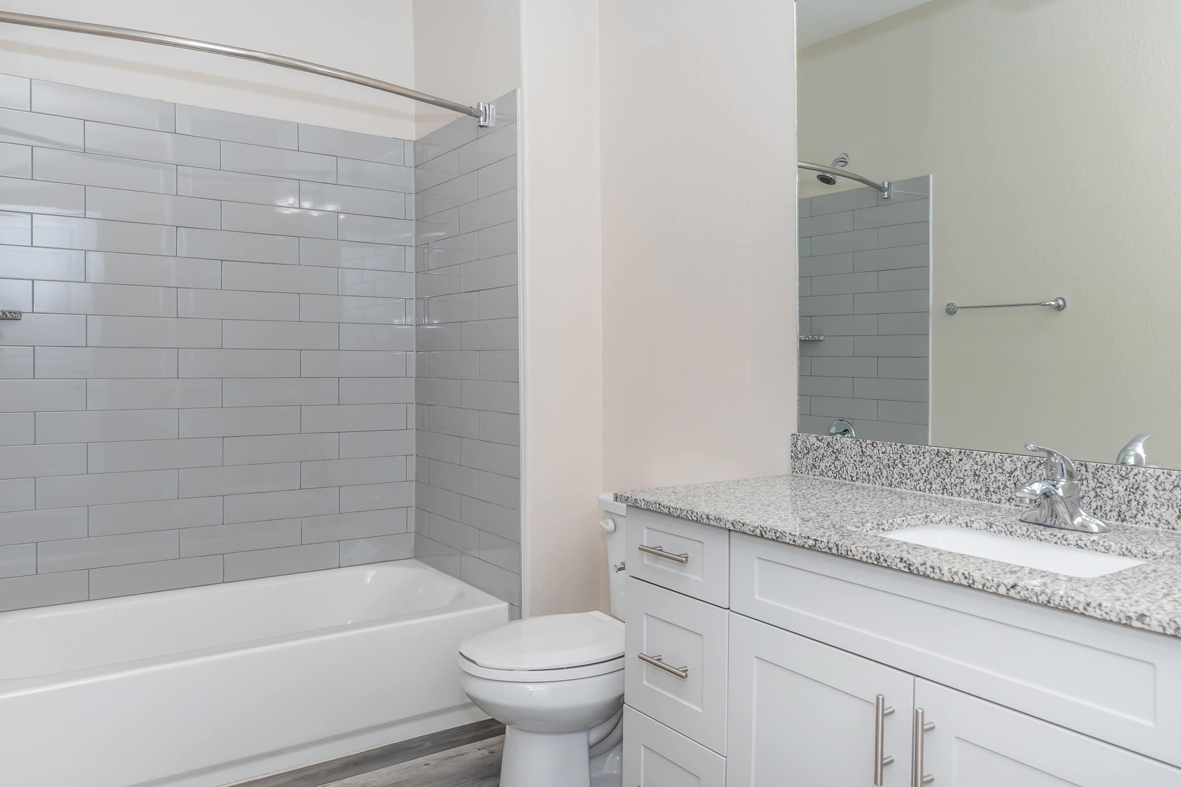 a room with a sink and a shower