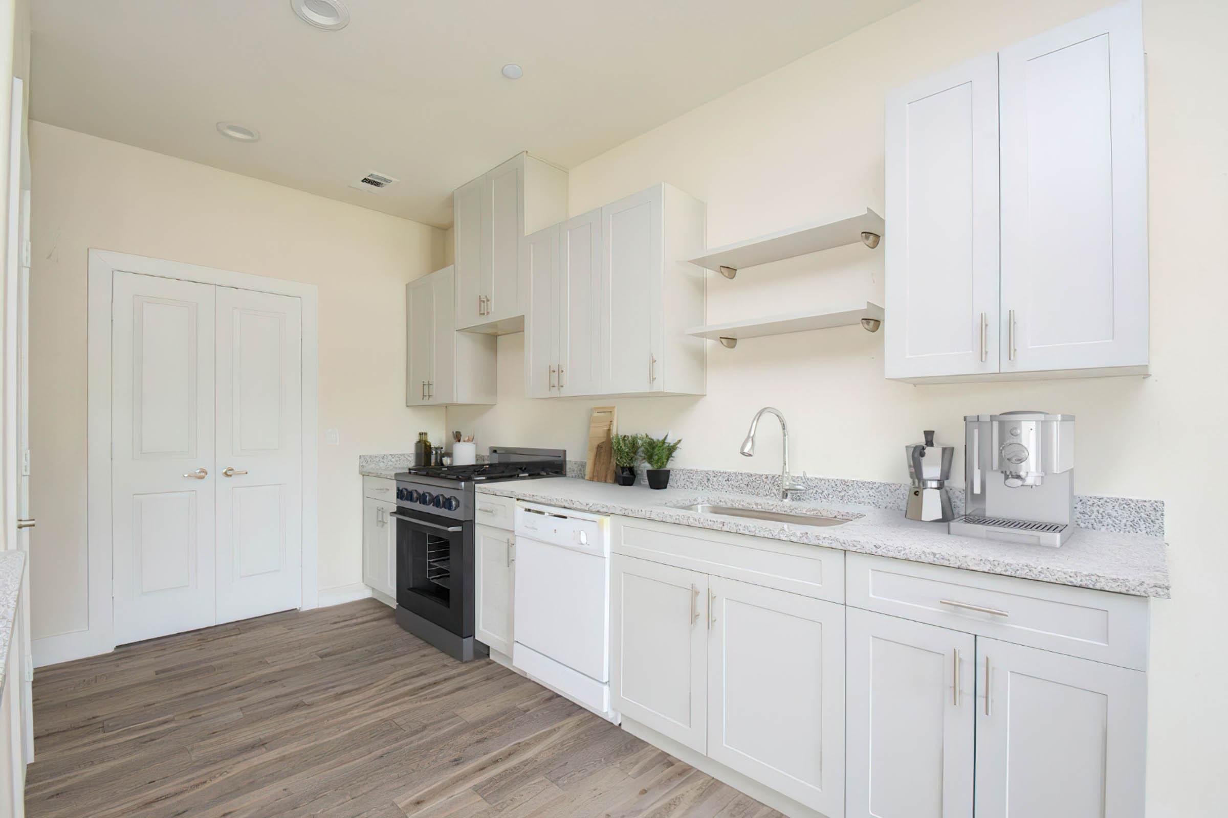 a kitchen with a sink and a refrigerator