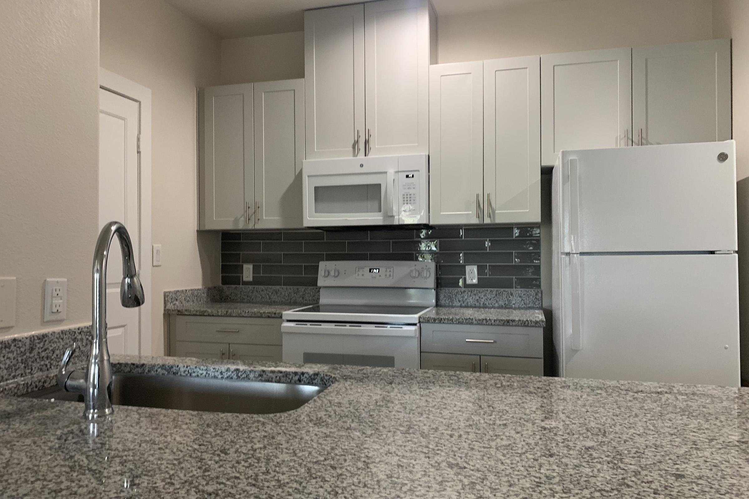 a stainless steel refrigerator in a kitchen