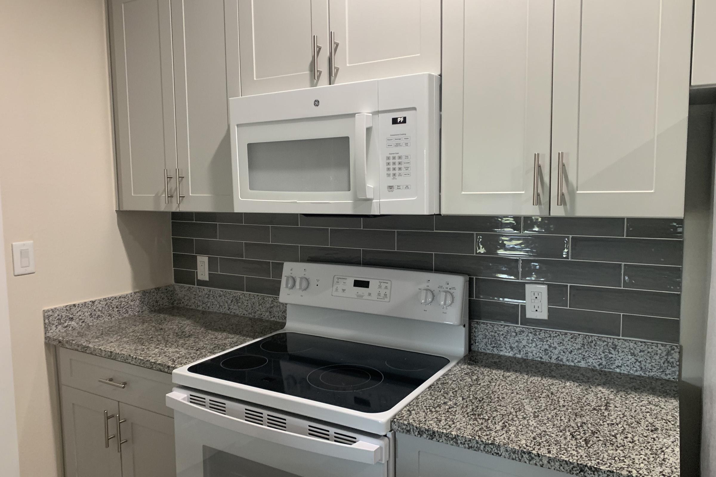 a kitchen with a stove and a sink