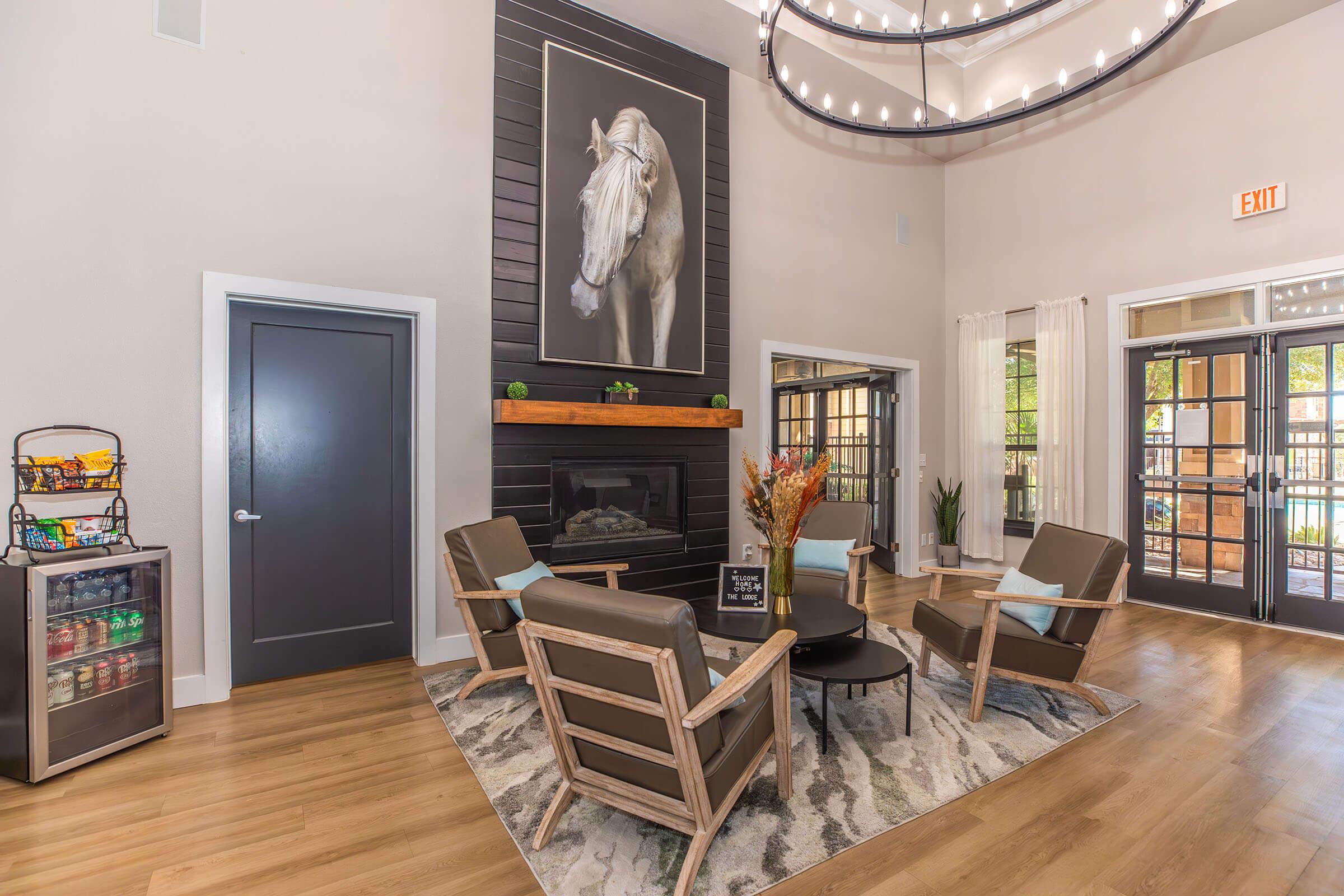 a living room filled with furniture and a fireplace