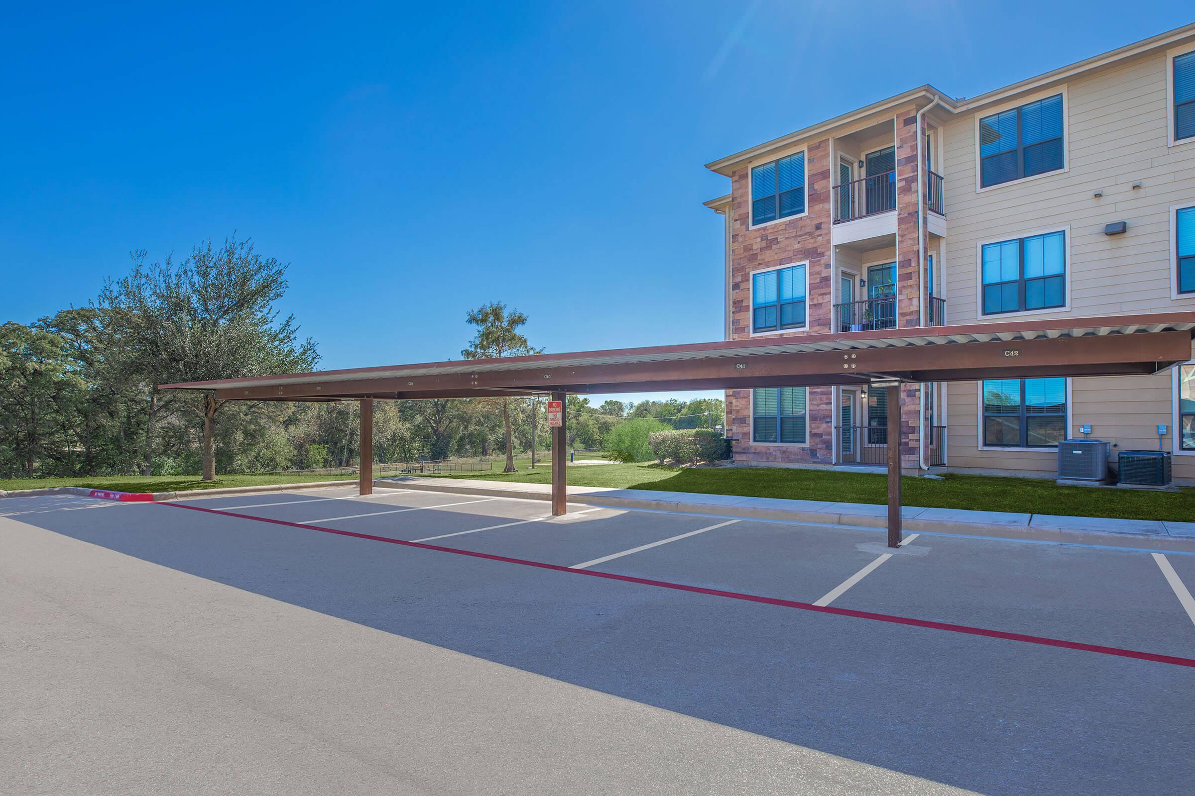 an empty parking lot in front of a building