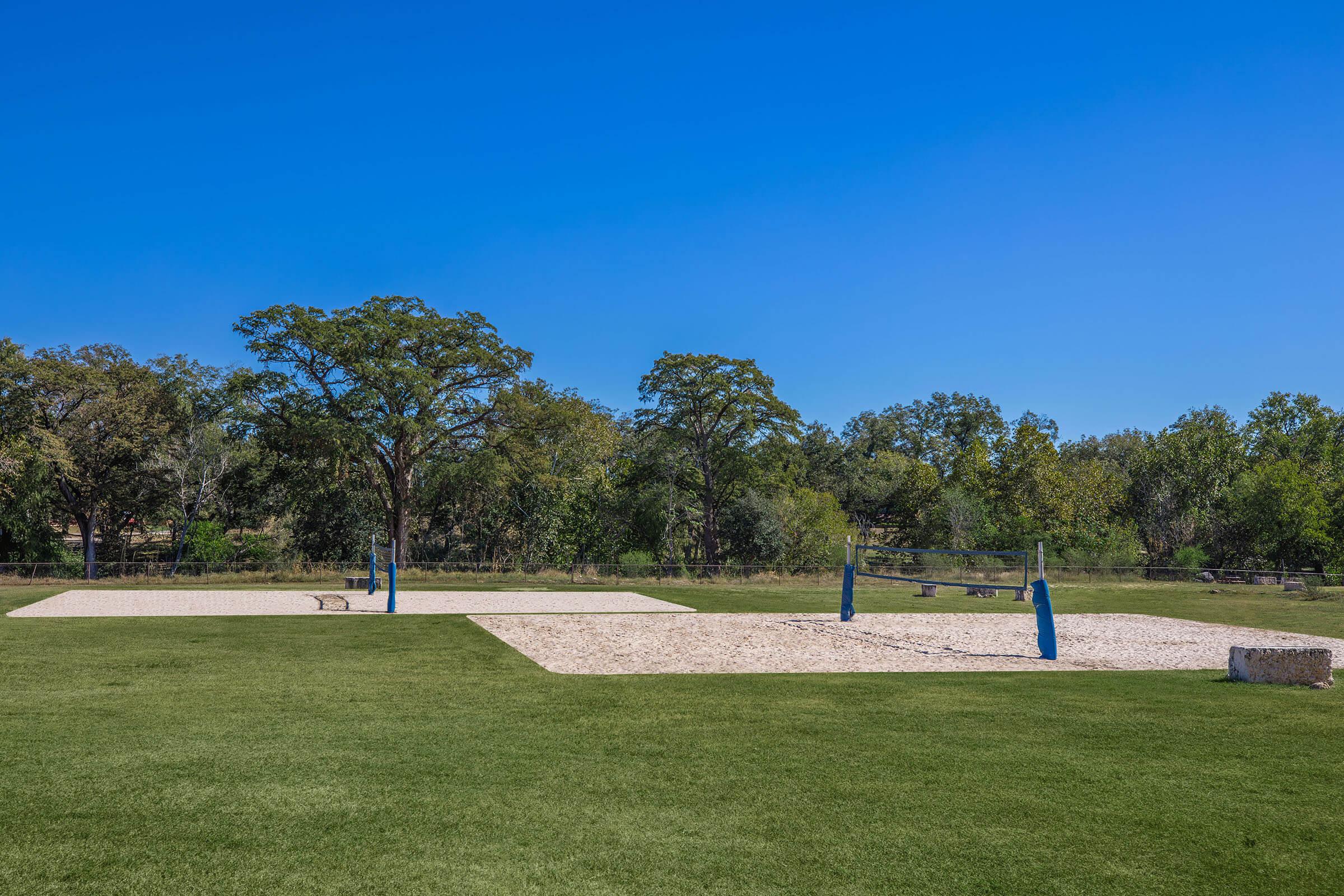 a person flying a kite in a park