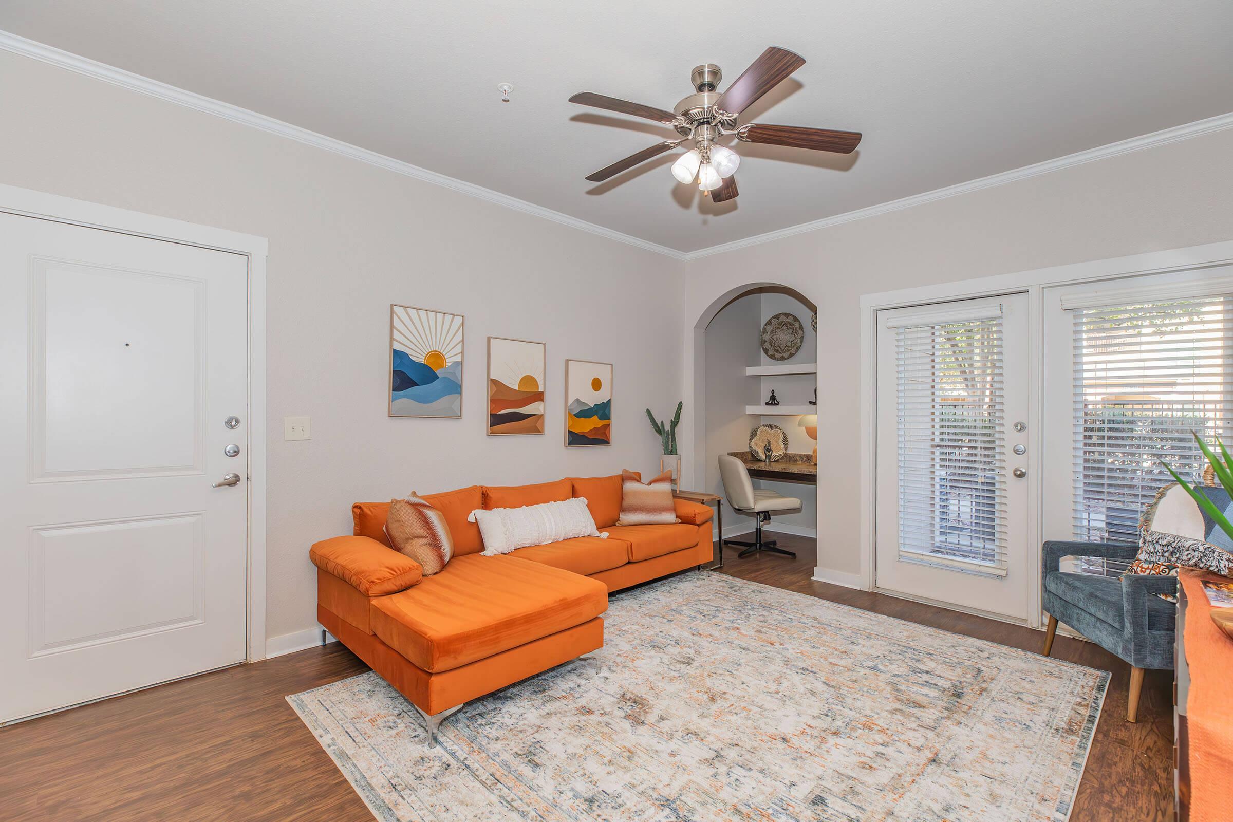 a room filled with furniture and a large window