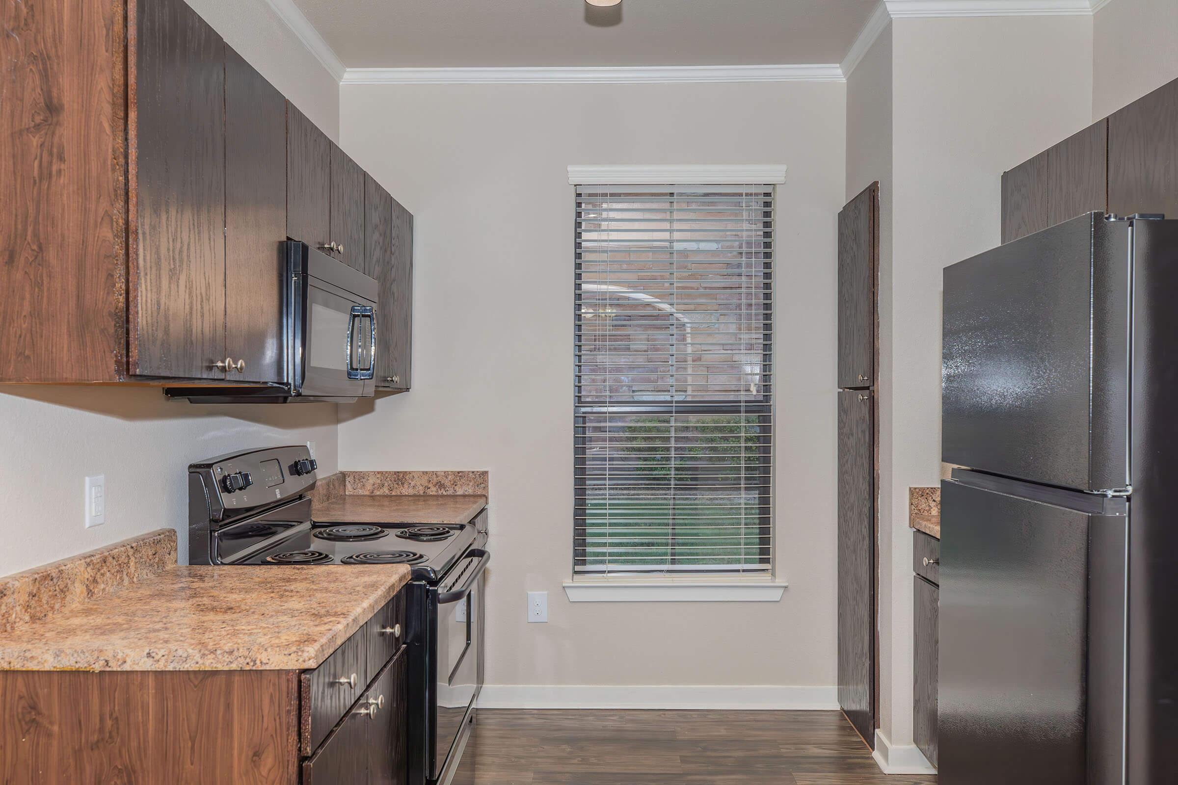 a stainless steel refrigerator in a kitchen