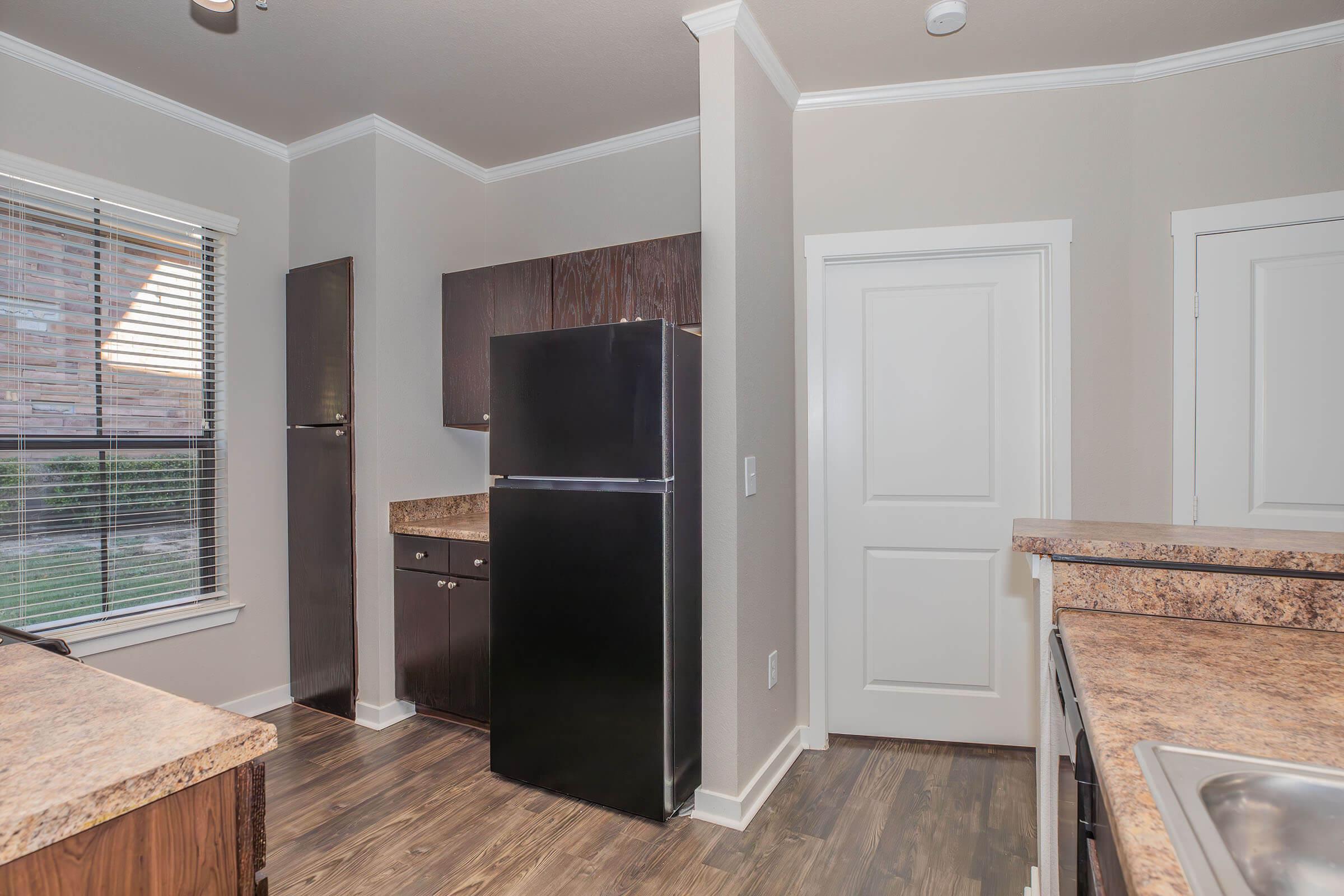 a kitchen with a stove top oven sitting inside of a building