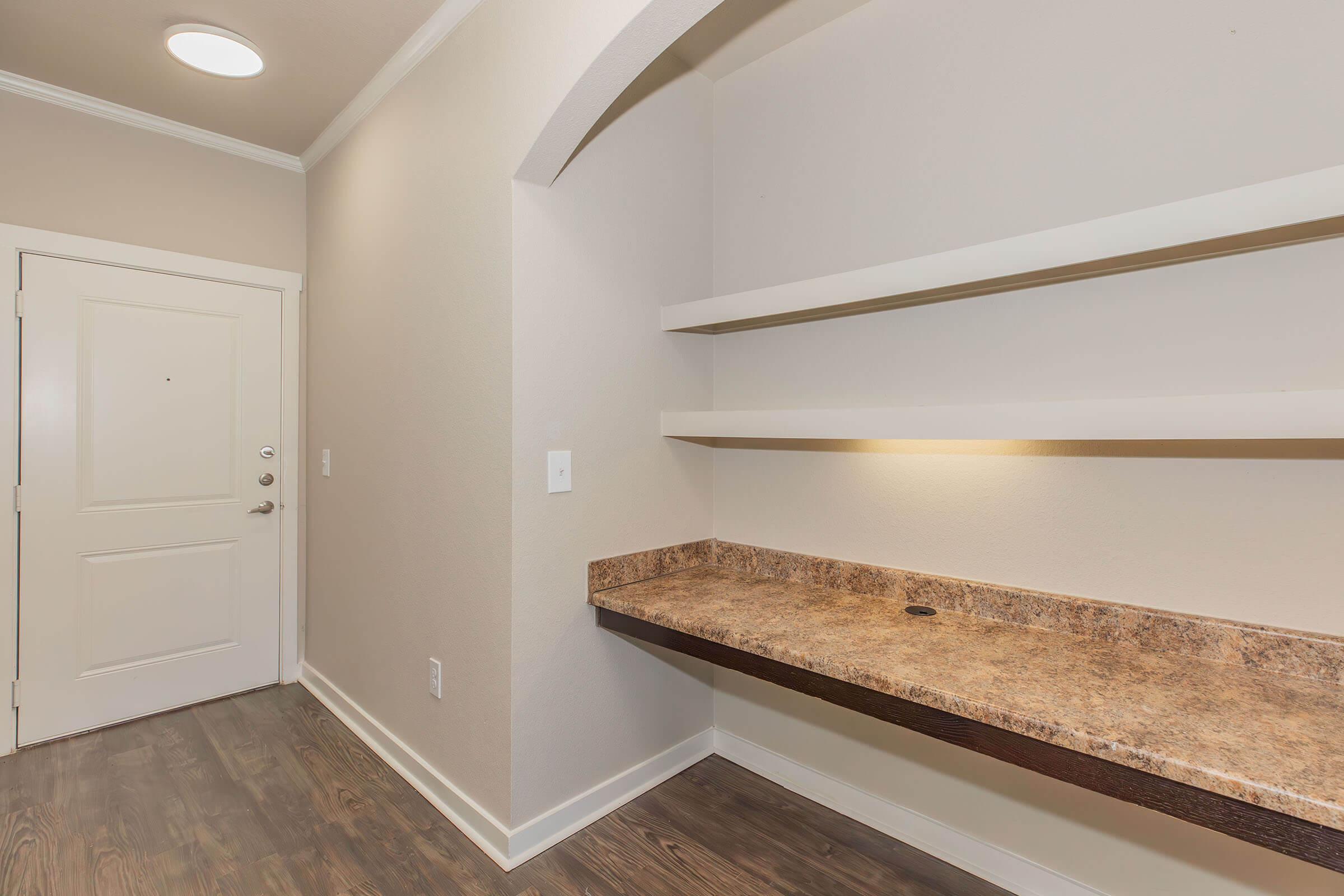 a kitchen with a sink and a mirror