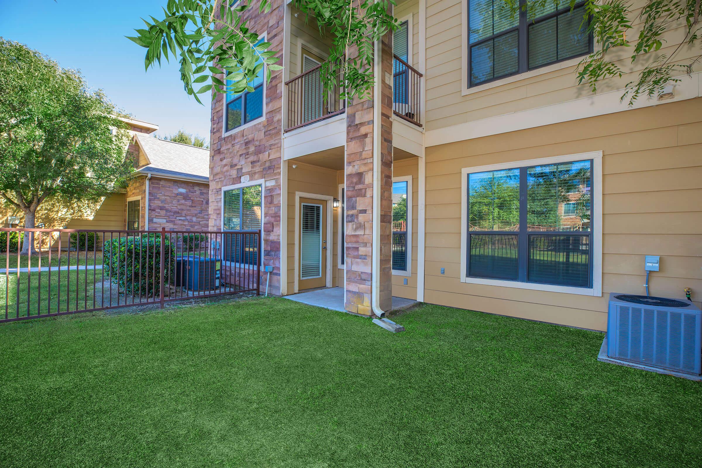 a large lawn in front of a house