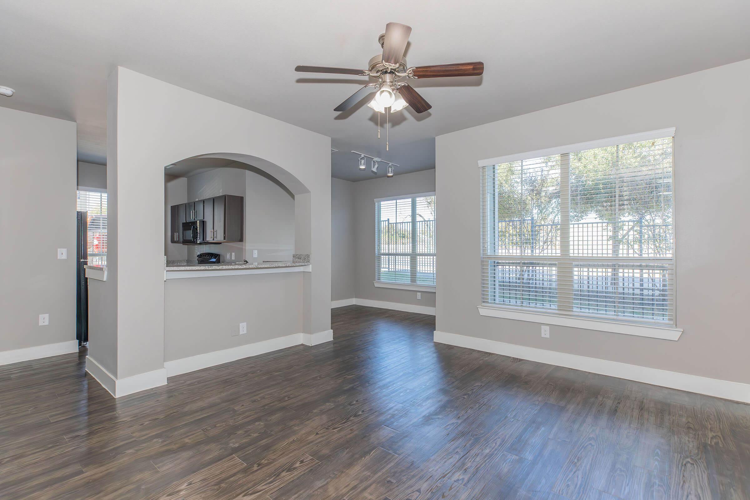 a room filled with furniture and a large window