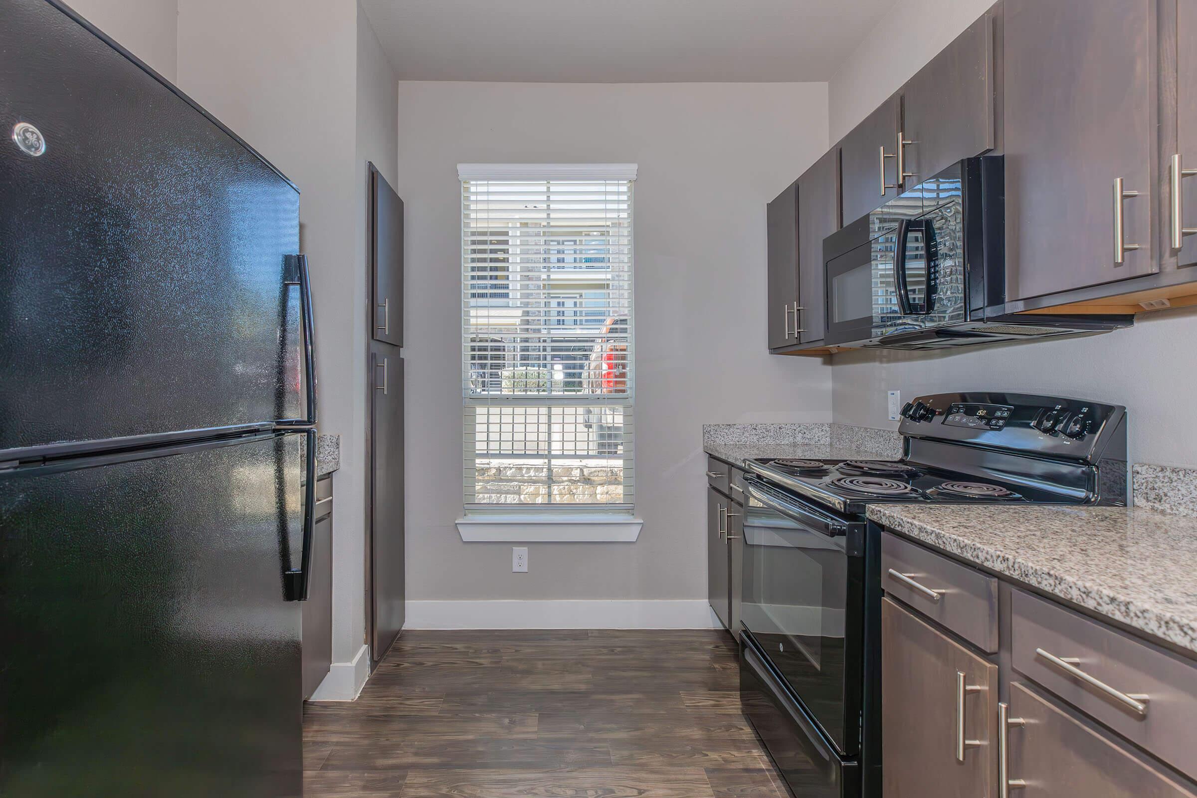 a large kitchen with stainless steel appliances