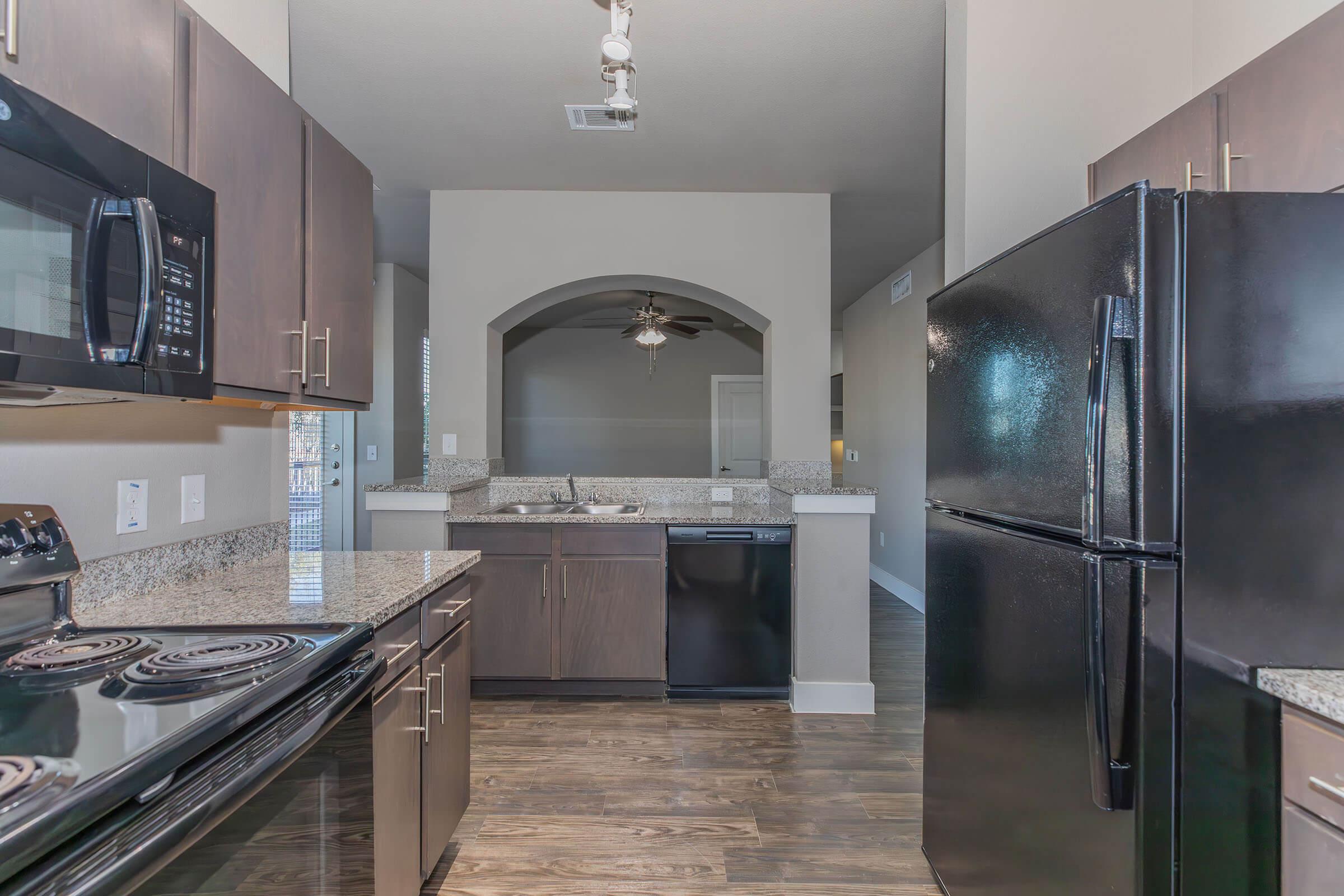 a modern kitchen with stainless steel appliances