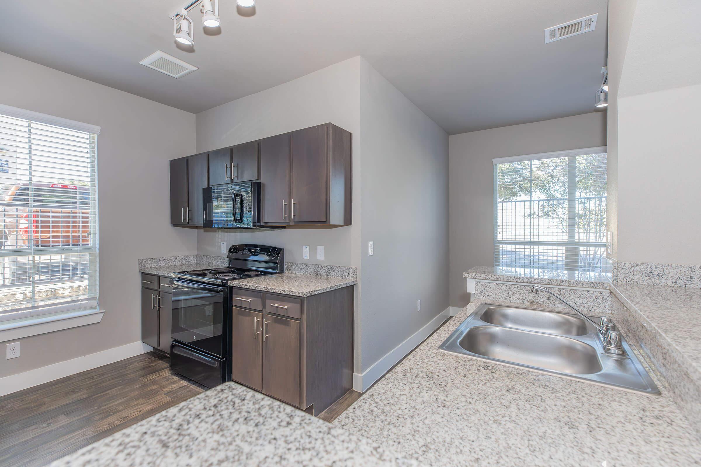 a kitchen with a sink and a window