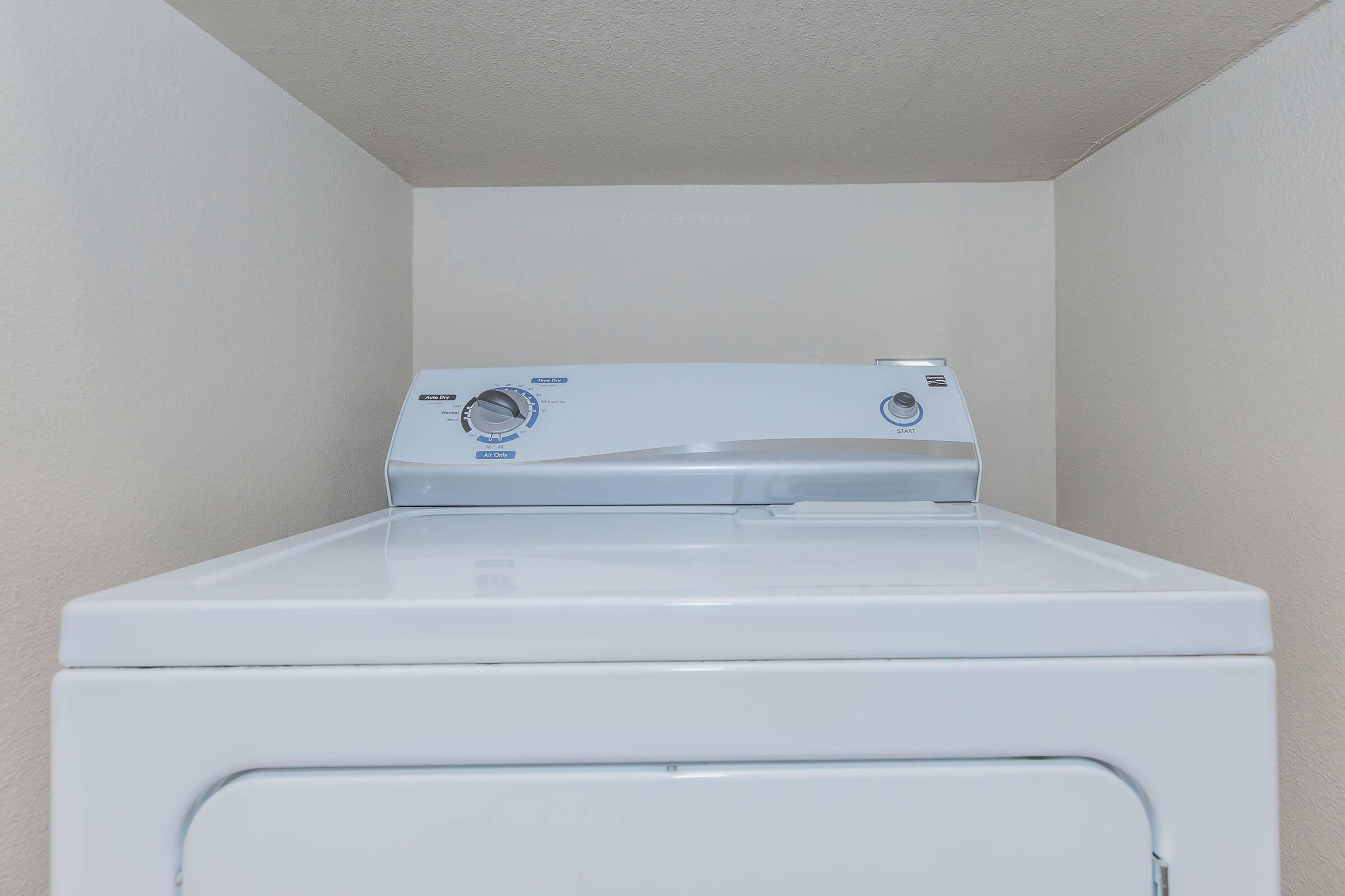 a microwave oven sitting on top of a stove