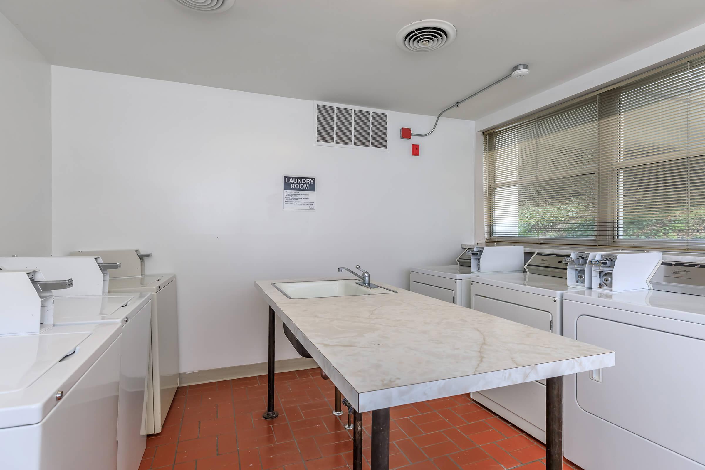 a kitchen with a table in a room