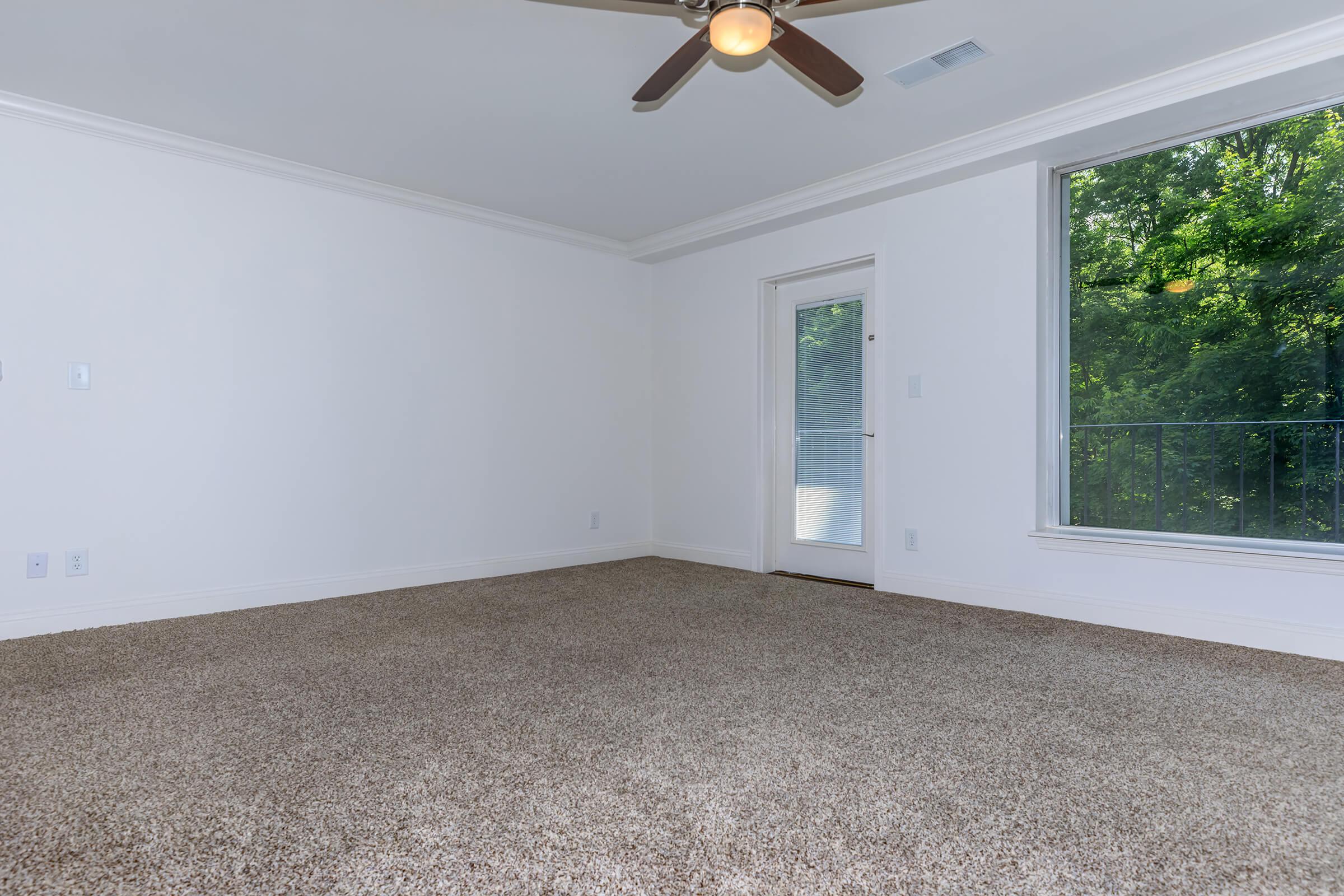 a bedroom with a large window