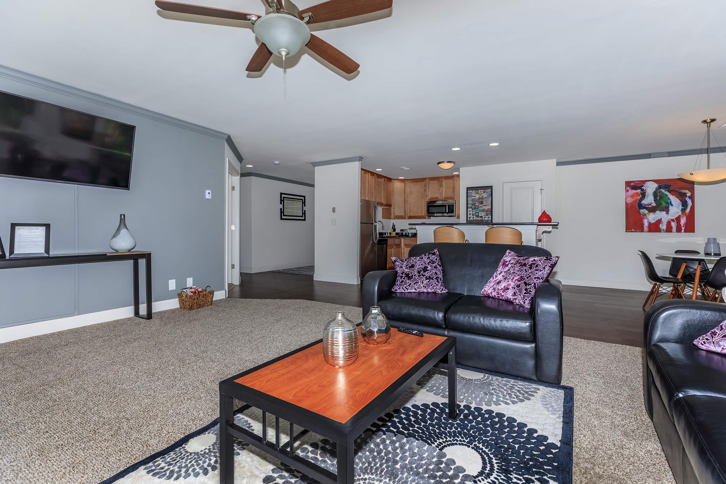 a living room filled with furniture and a table