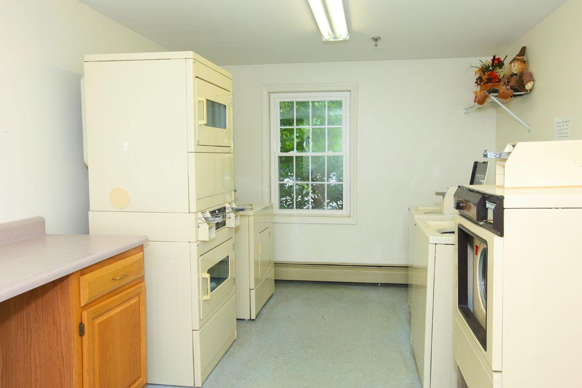 a white refrigerator freezer sitting inside of a kitchen