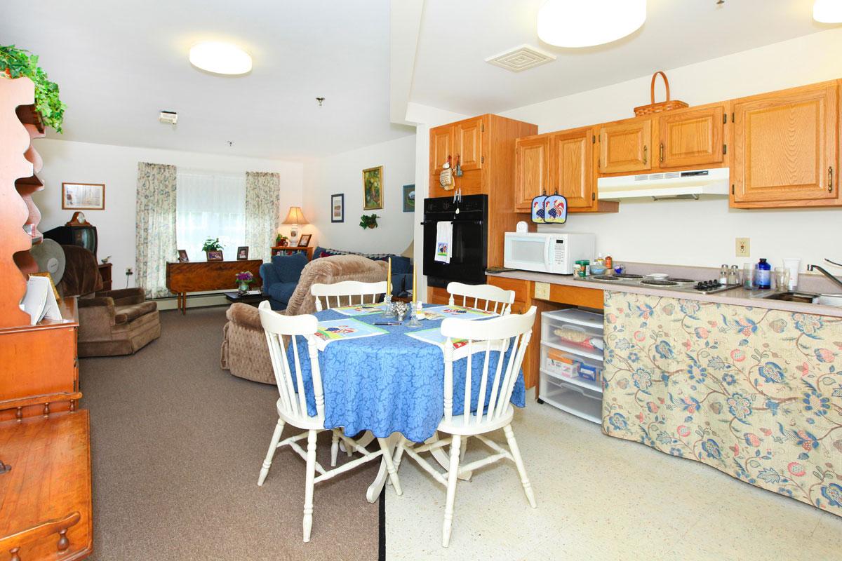 a kitchen filled with lots of furniture