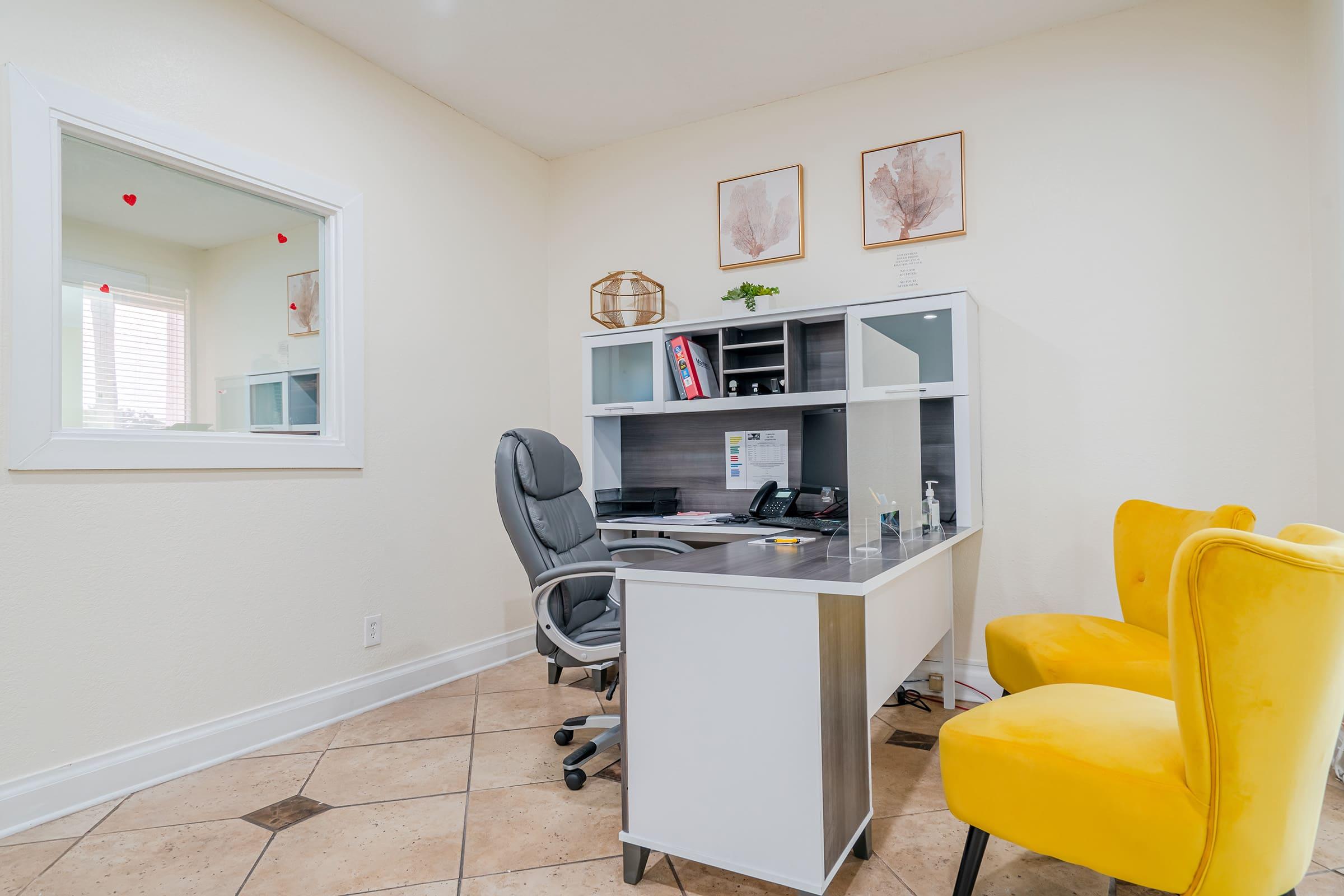 a living room filled with furniture and a tv