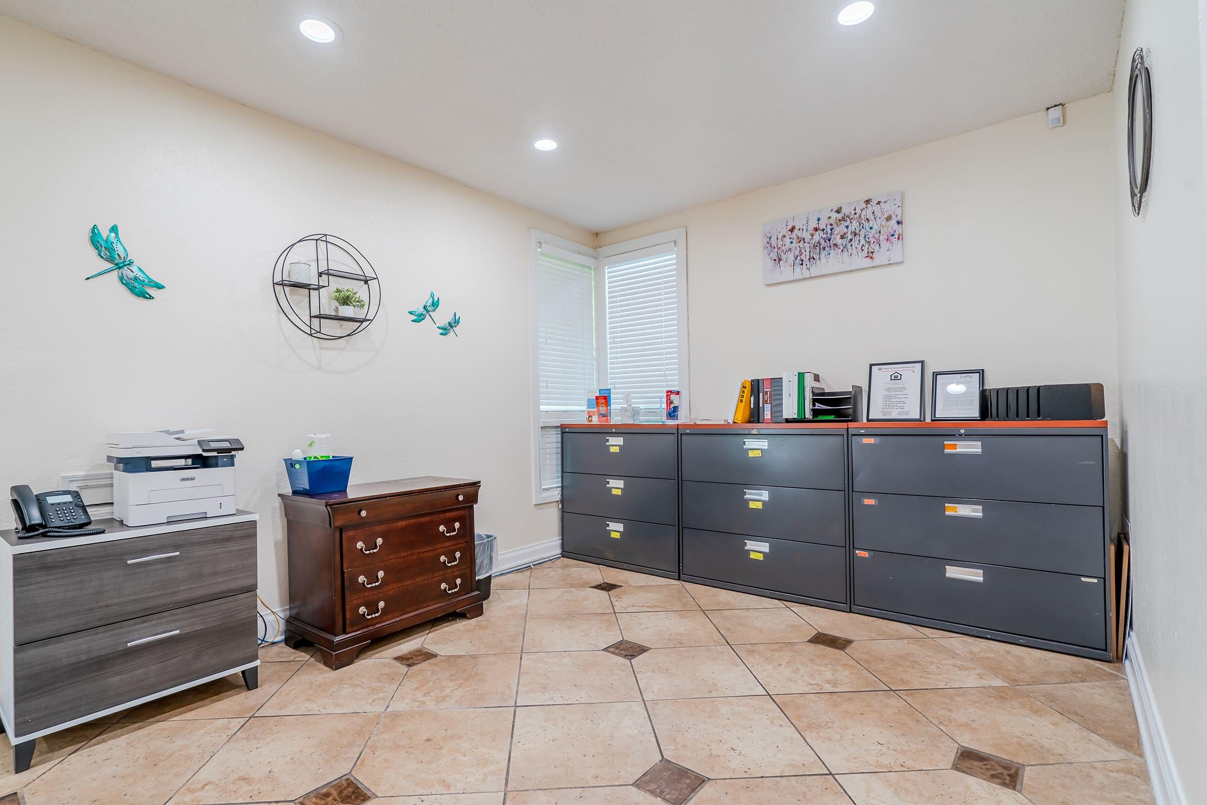 a kitchen with a stove top oven sitting inside of a room