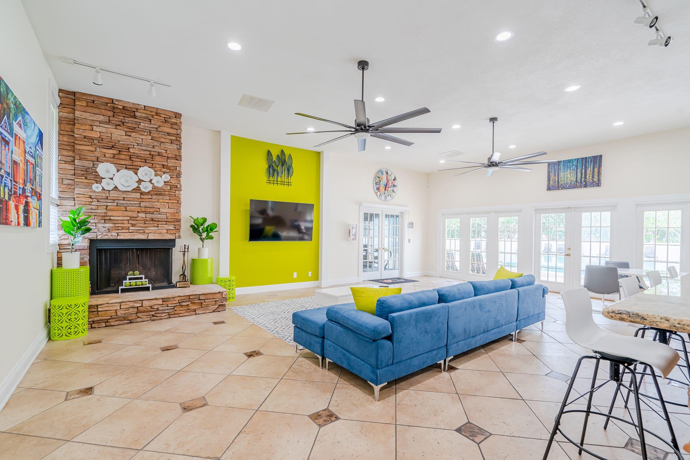 a living room filled with furniture and a fireplace