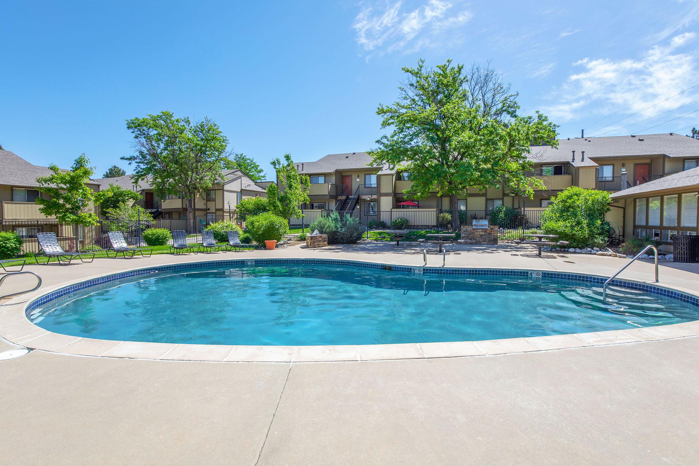 a large pool of water in front of a house