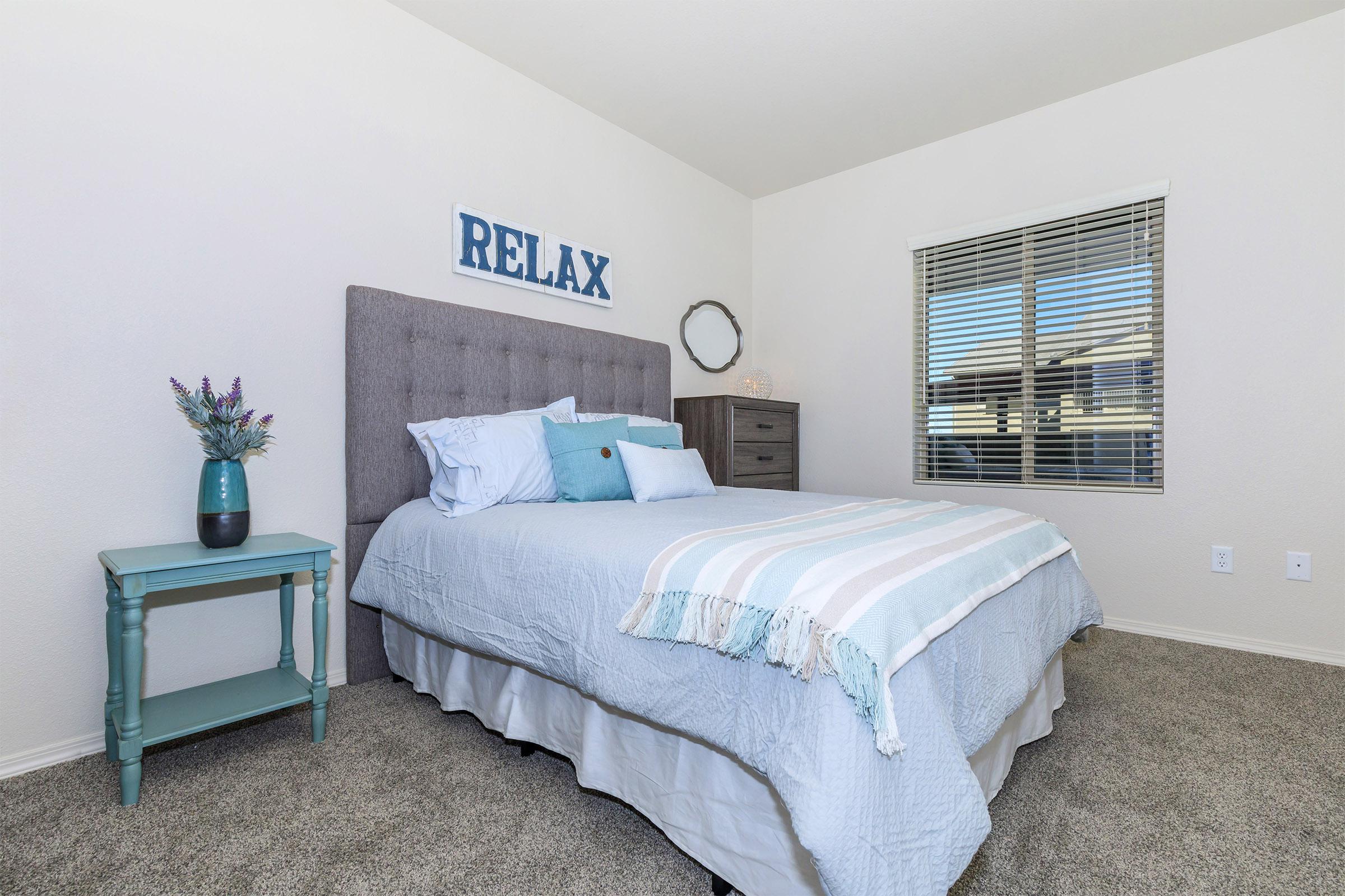 a bedroom with a large bed sitting in a room