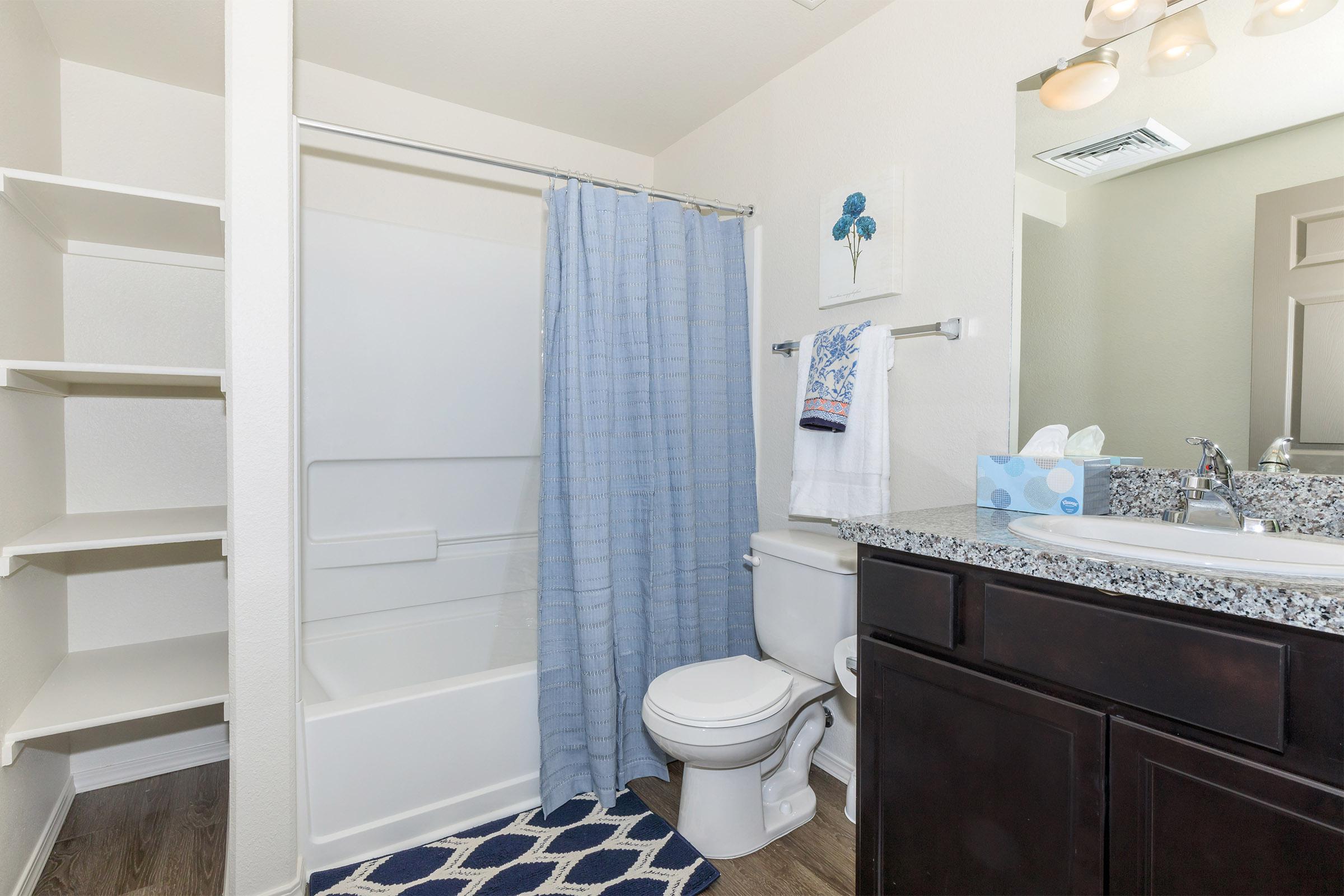 a room with a sink and a mirror