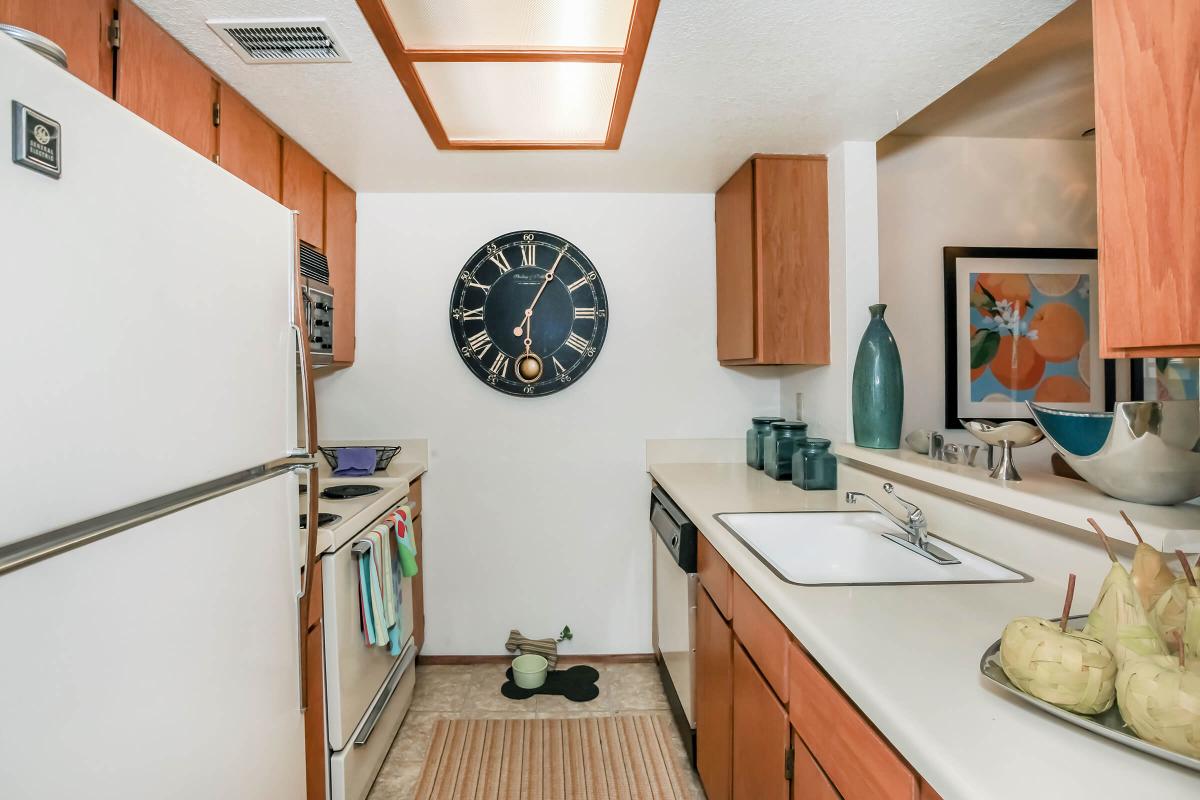 a kitchen with a table and looking at the camera