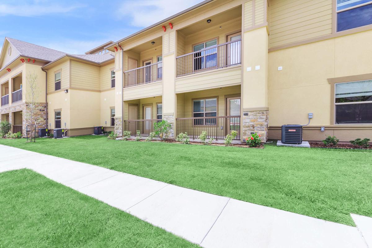 a large lawn in front of a building