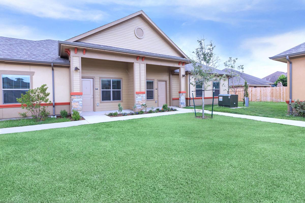 a large lawn in front of a house