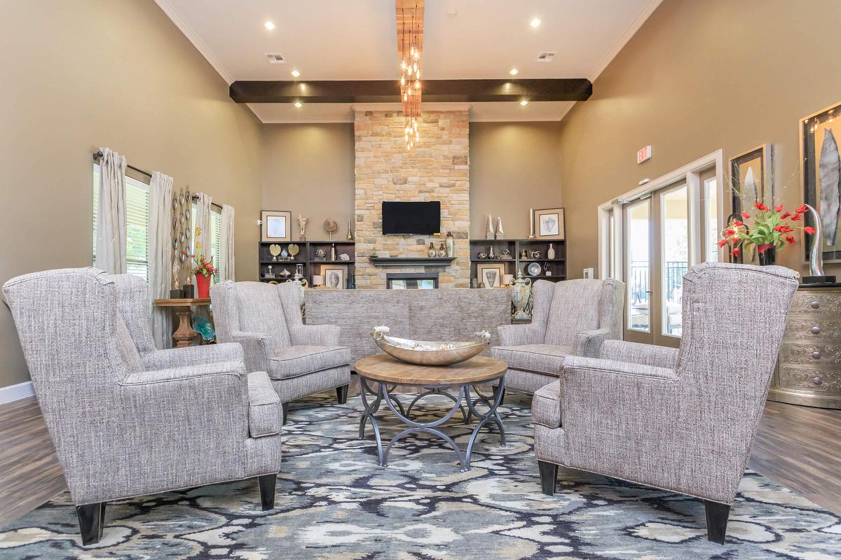 a living room filled with furniture and a fireplace