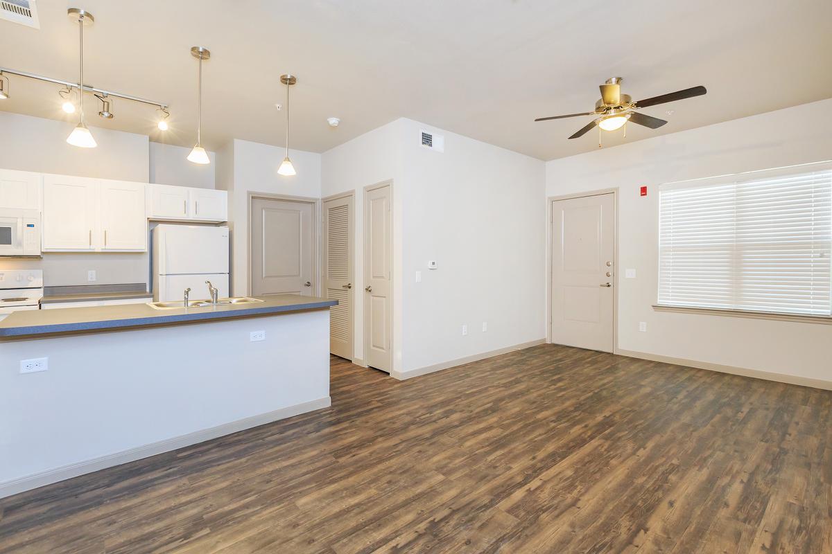 a large kitchen with white cabinets