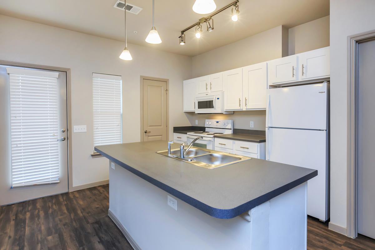 a kitchen with a sink and a window