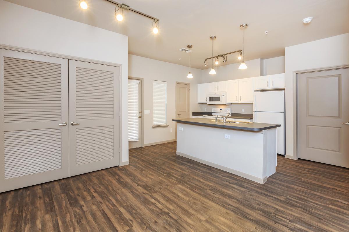 a kitchen with a wood floor