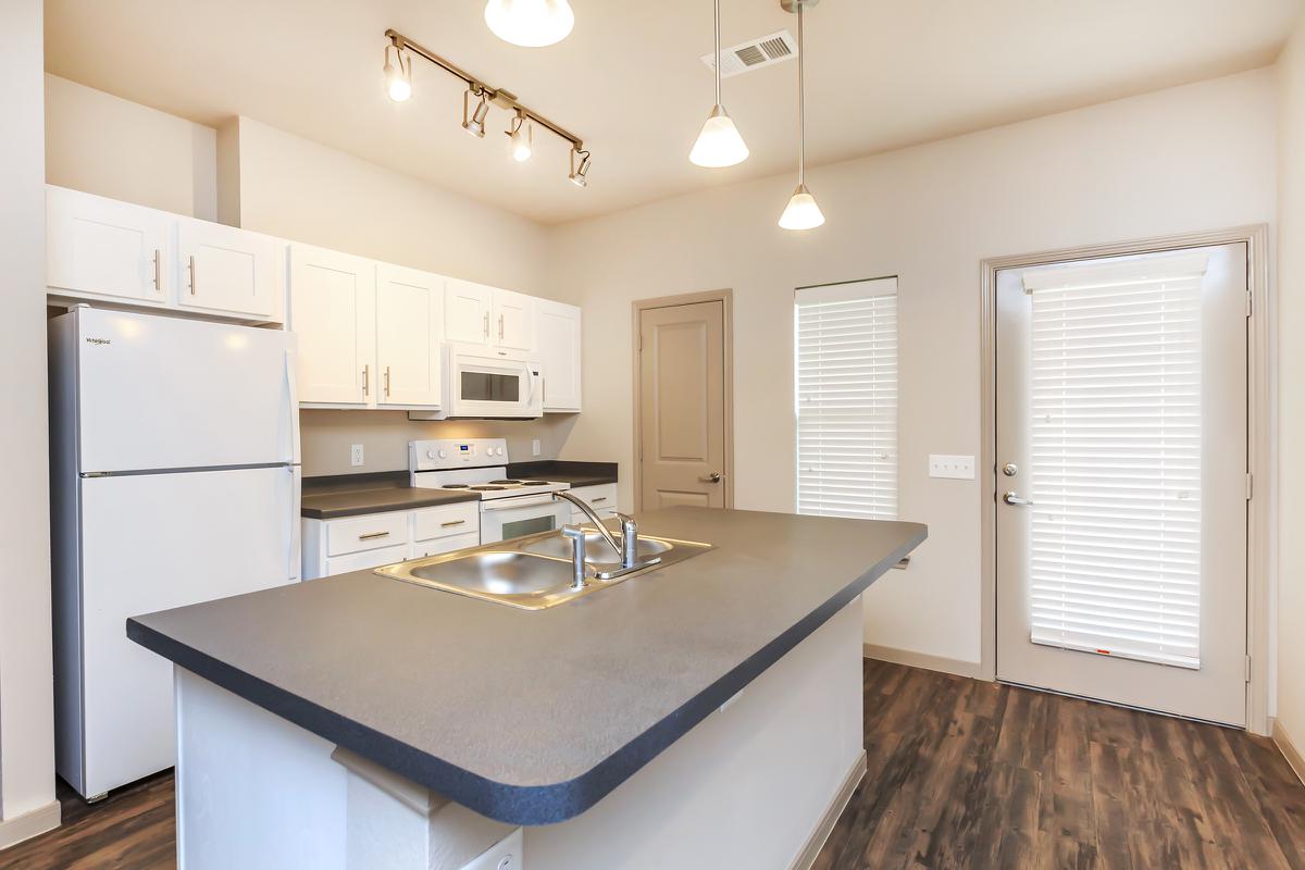 a kitchen with a sink and a window