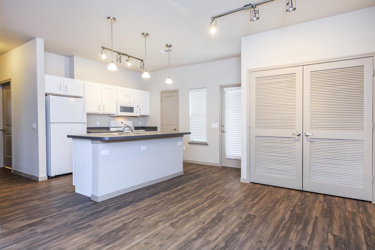 a large white refrigerator in a kitchen