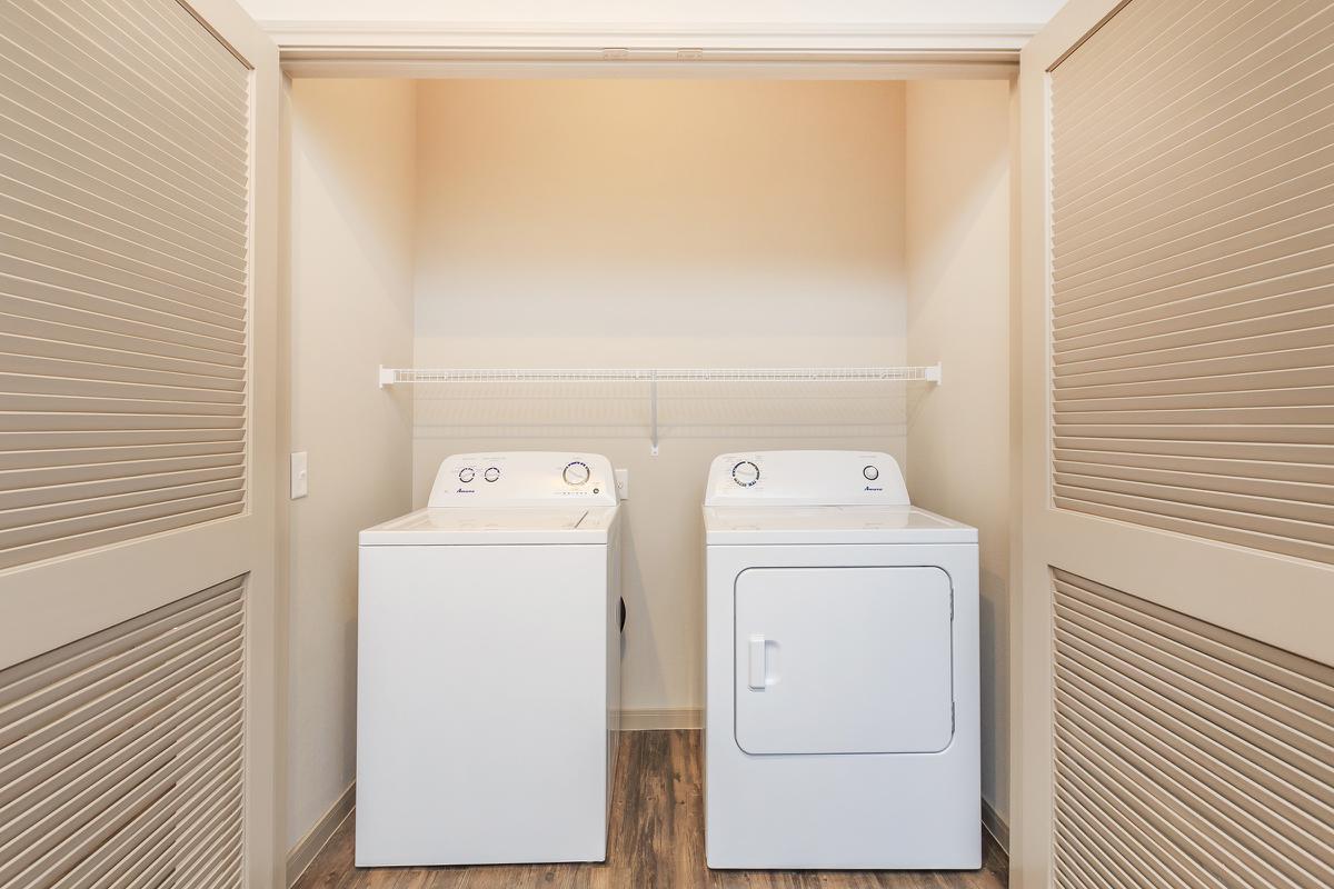 a white refrigerator freezer sitting next to a window