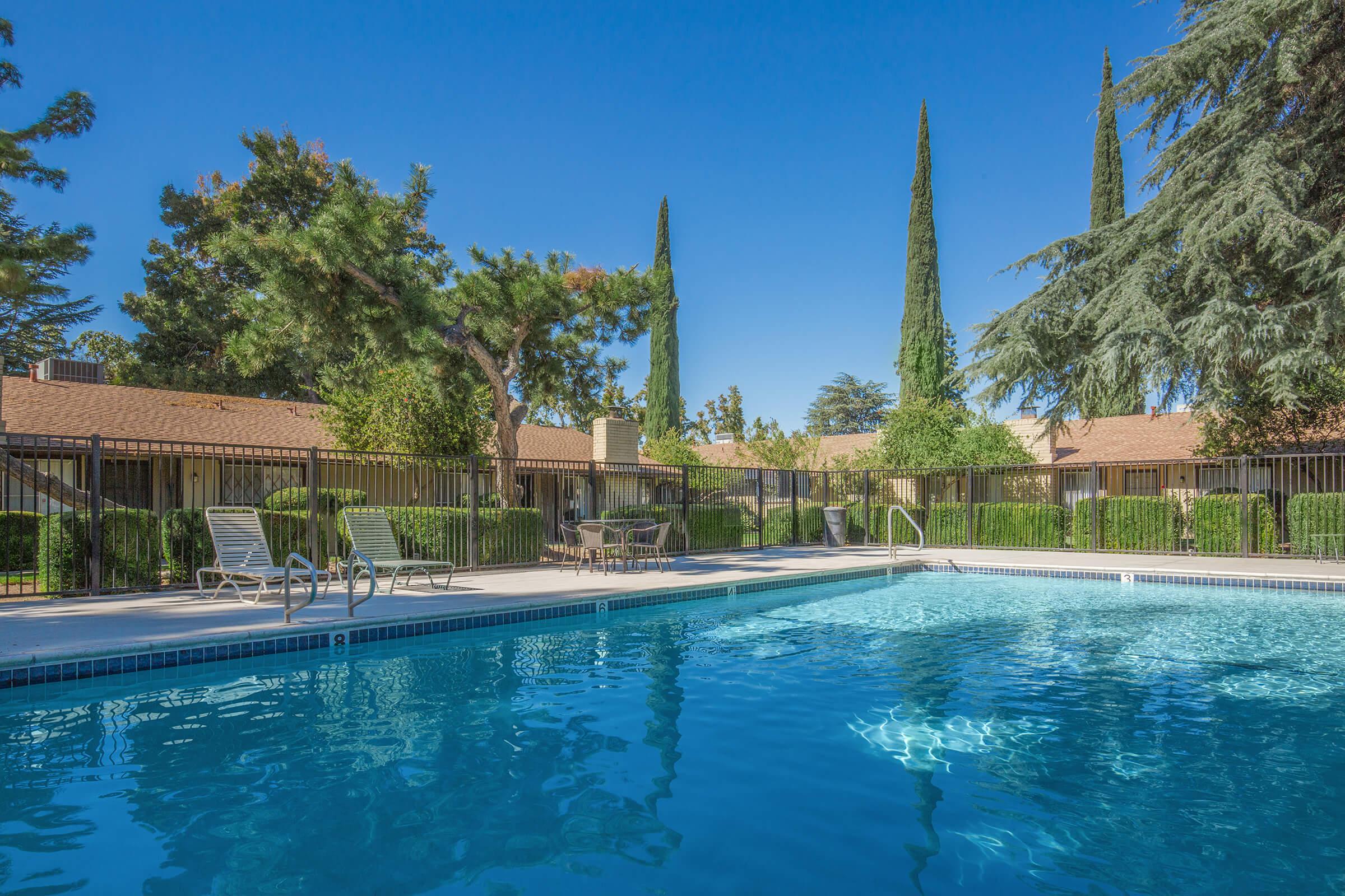 a large pool of water in front of a house