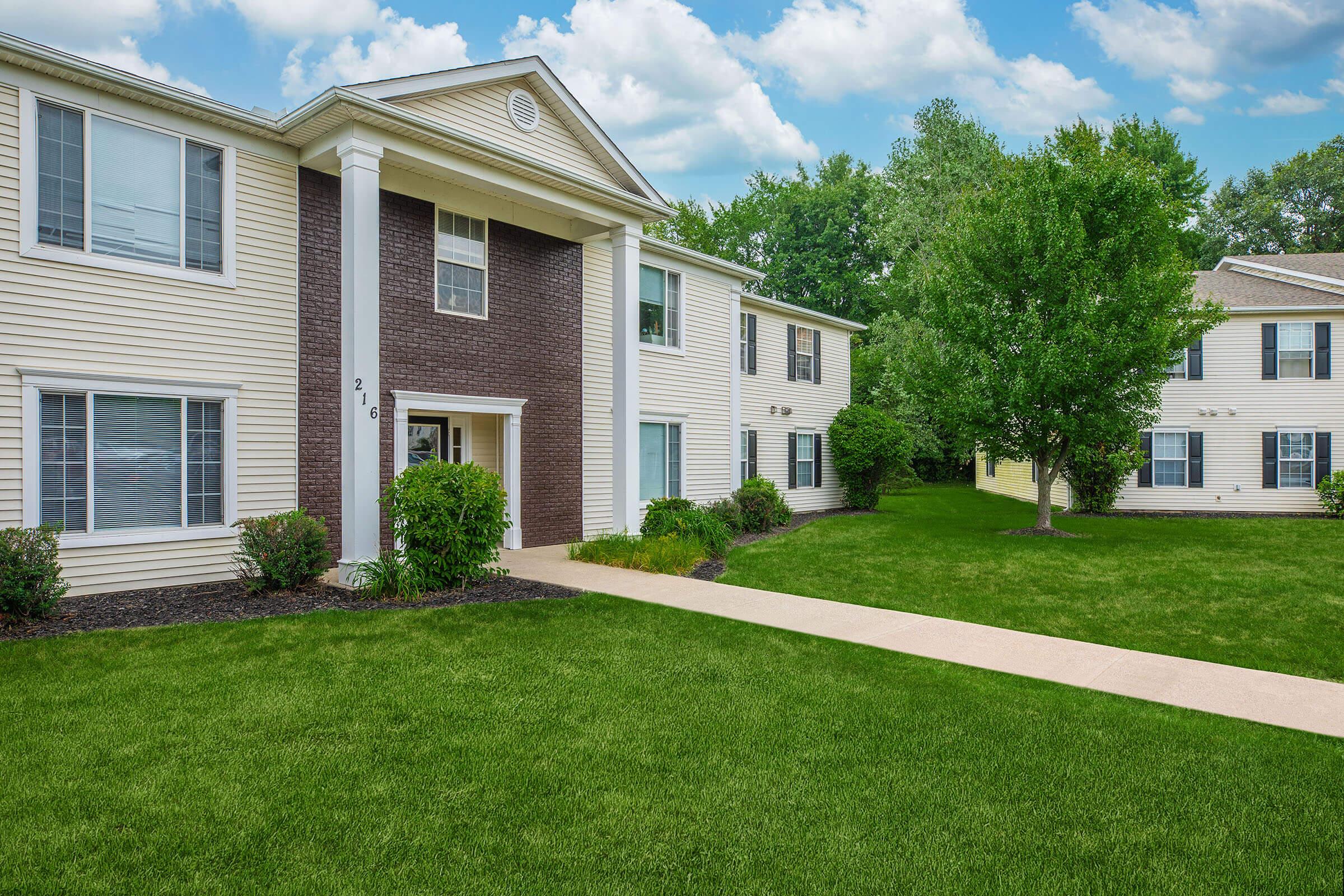 a large lawn in front of a house